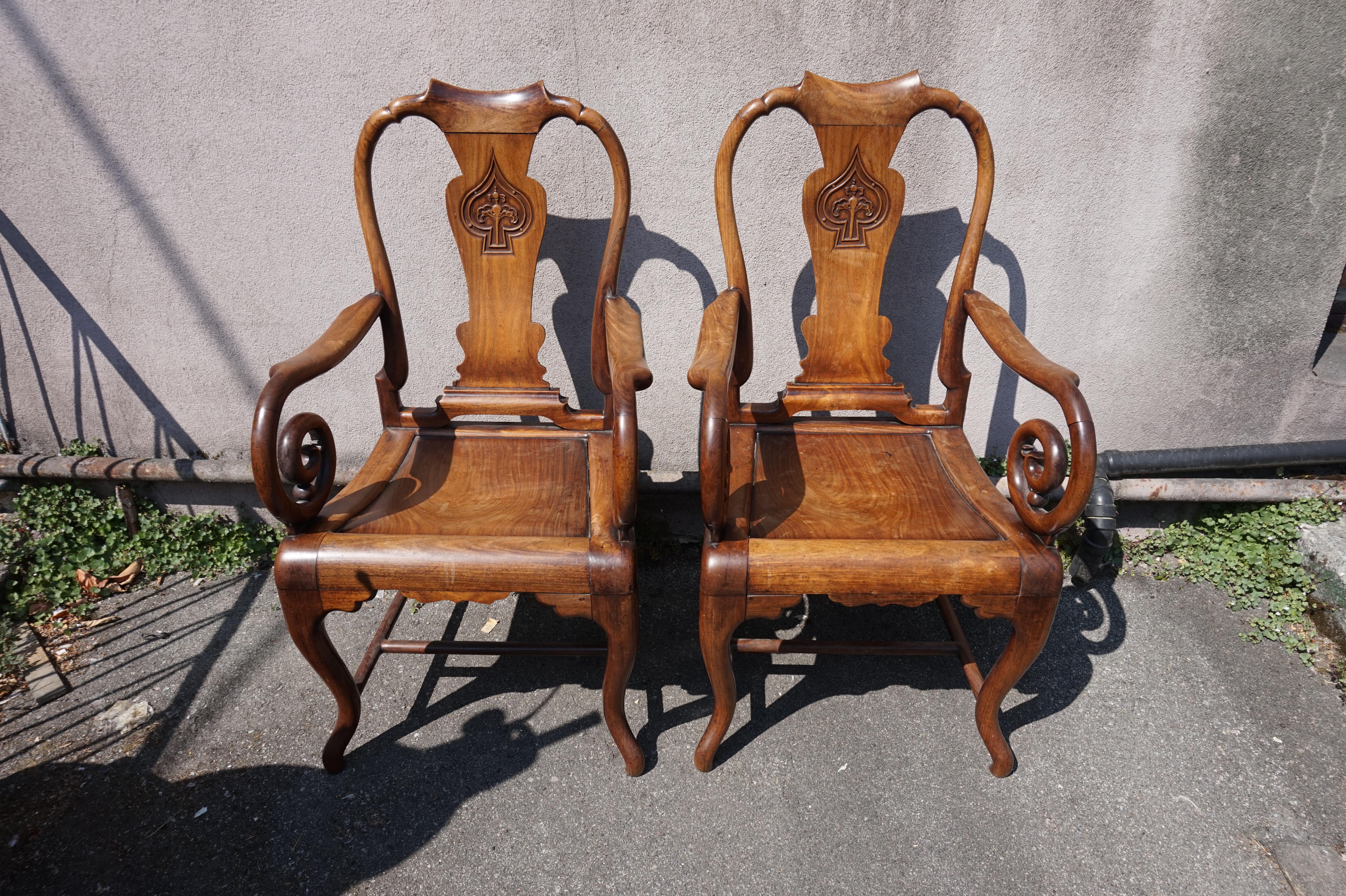Circa 1890-1900

Exquisitely hand carved Chinese Mahjong chairs with scrolling arms and solid seats. United by stretchers and old joinery work. Top notch craftsmanship, these are conversation pieces that exude design and refinement and look good