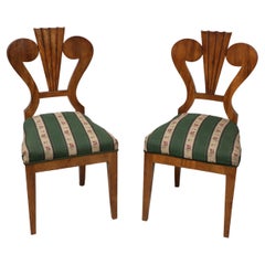 19th Century Pair of Biedermeier Walnut Chairs. Vienna, c. 1825.