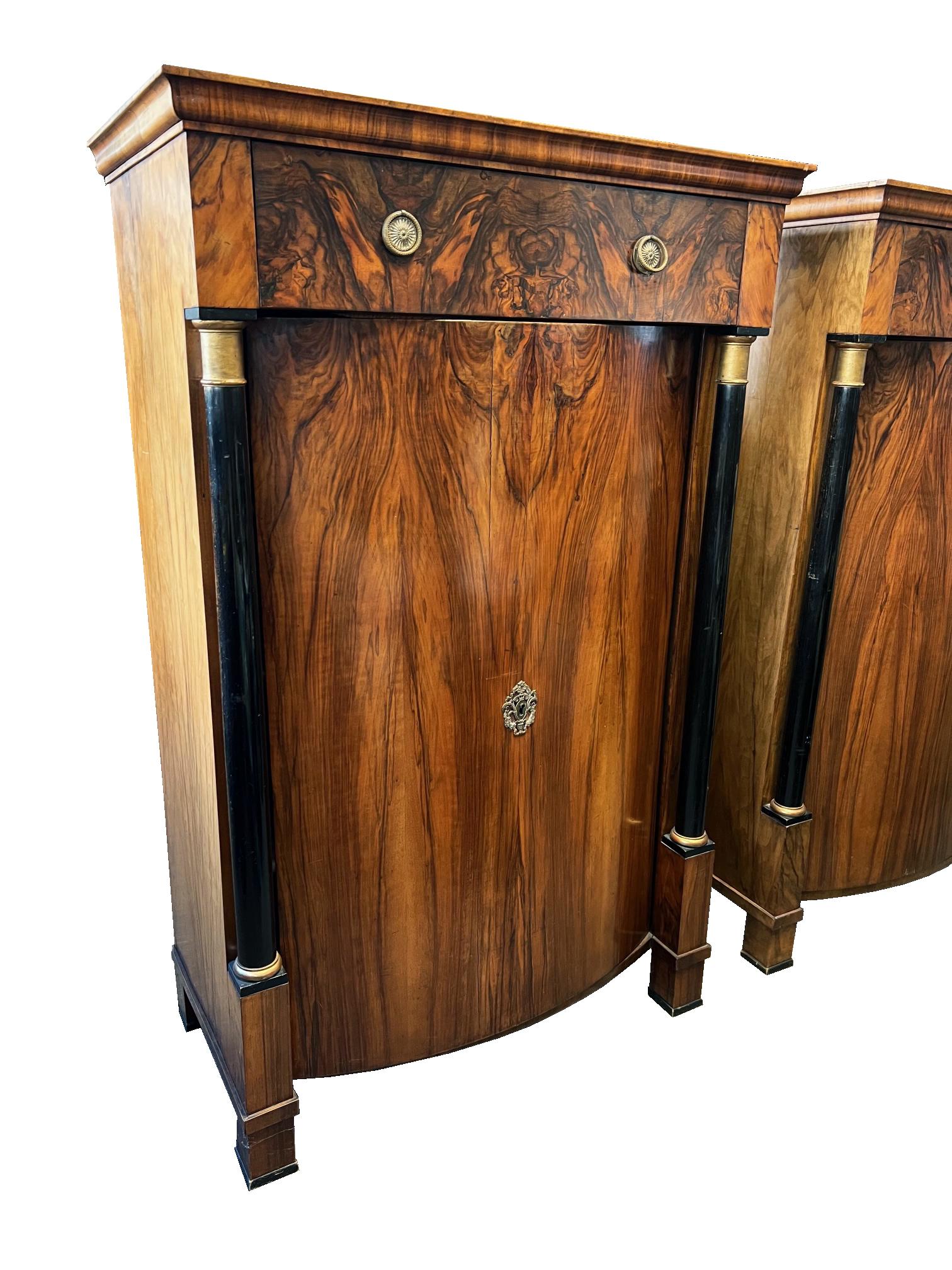 Hello,
This stunning pair of Biedermeier trumeau cabinets ware made in Vienna circa 1825.

Viennese Biedermeier is distinguished by their sophisticated proportions, rare and refined design and excellent craftsmanship and continue to have a great