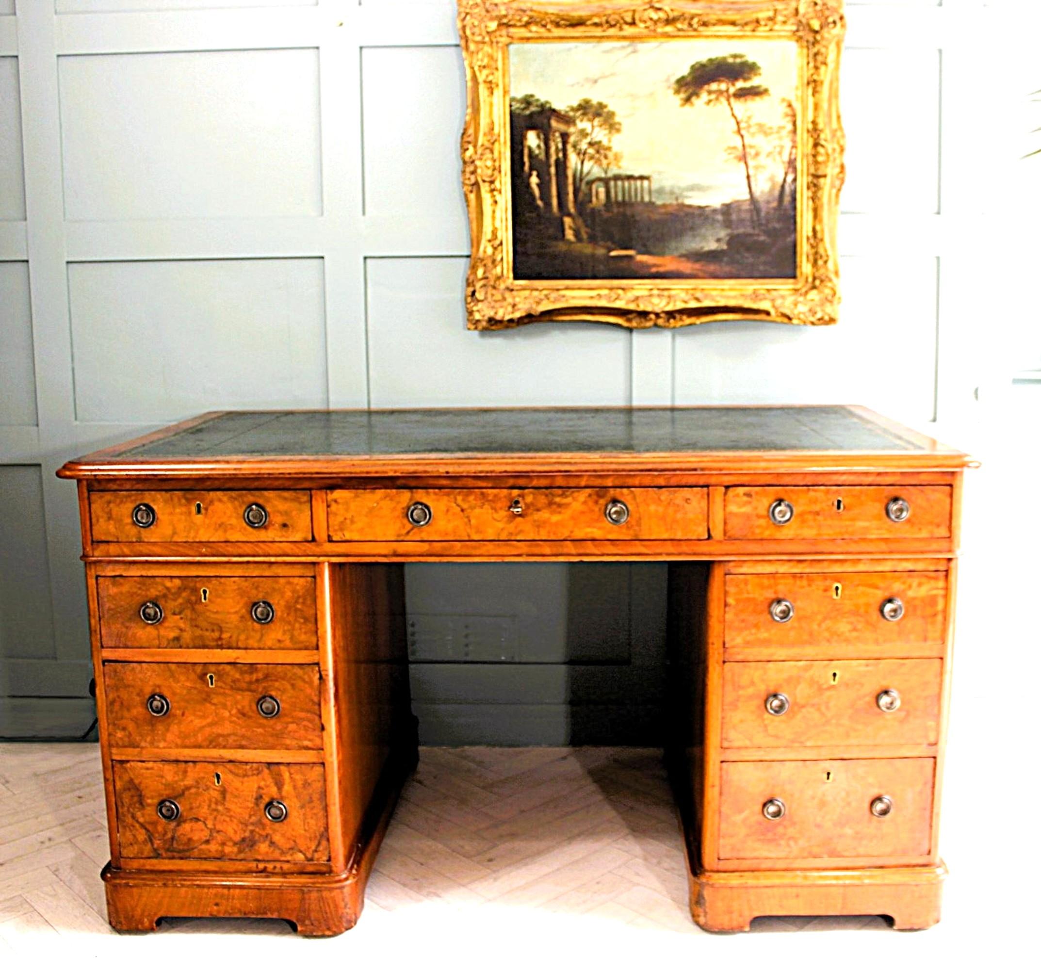 19th Century Burr Walnut Desk –  Elegance and Victorian Craftsmanship

Discover the unmatched charm and sophistication of our 19th-century figured burr walnut twin pedestal desk, a fine example of Victorian antique walnut furniture crafted in