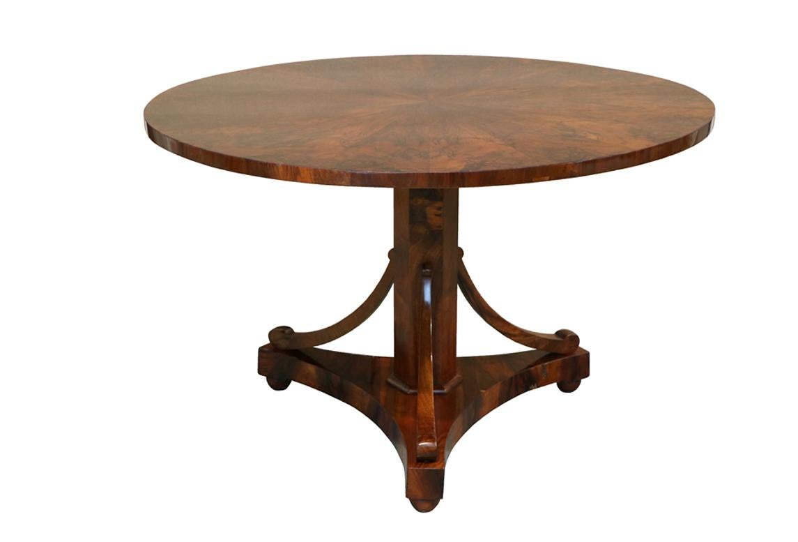 Hello,
This exceptional large Biedermeier salon walnut pedestal table was made in Vienna, c. 1825.

Viennese Biedermeier is distinguished by their sophisticated proportions, rare and refined design and excellent craftsmanship and continue to have a
