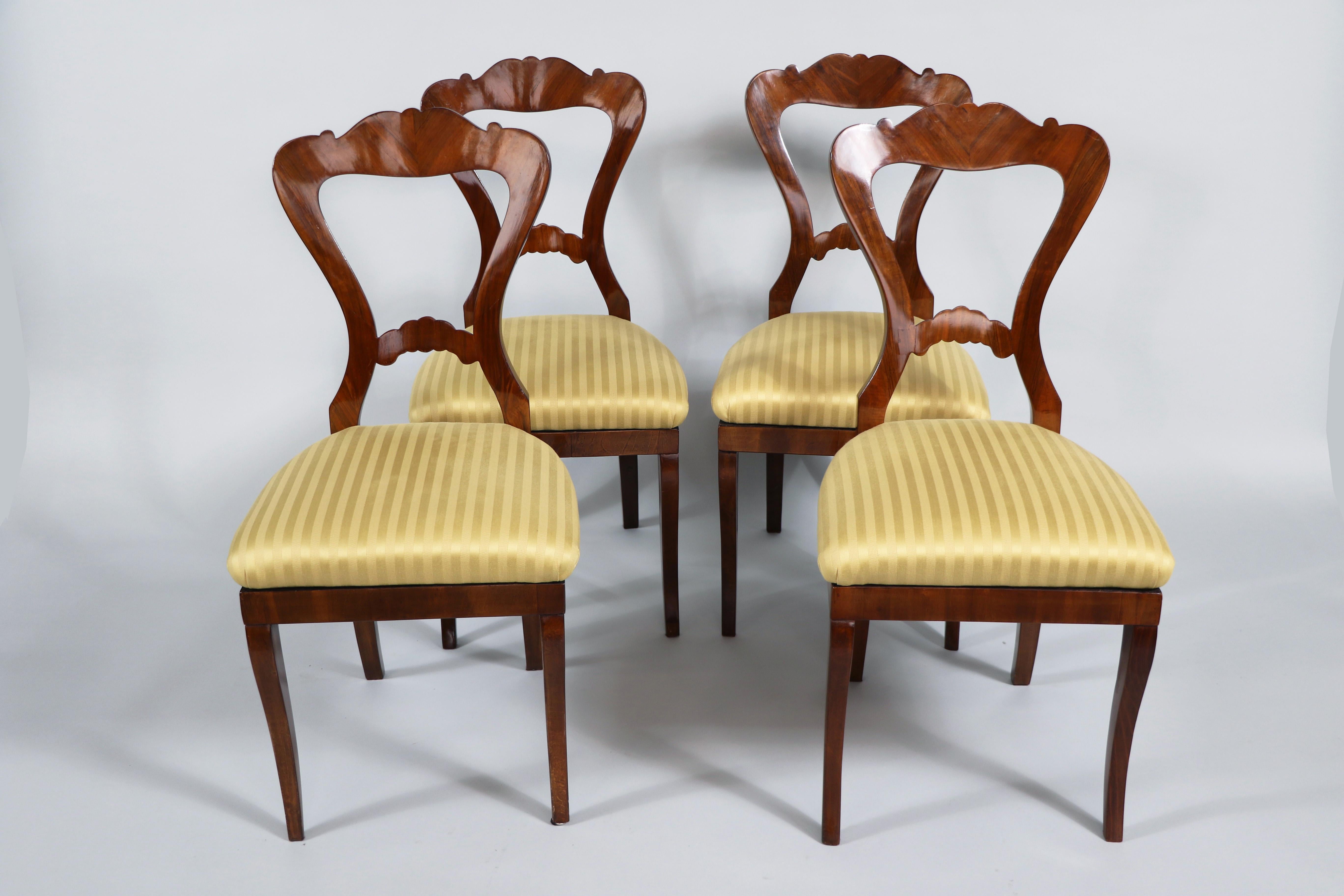 Hello,
These Fine set of four Viennese Biedermeier walnut chairs from circa 1825 is the best example of an early Viennese Biedermeier which reflect innovative design and highest quality craftsmanship.

Viennese Biedermeier pieces are distinguished