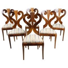 19th Century Fine Set of Six Biedermeier Walnut Chairs. Vienna, c. 1825.