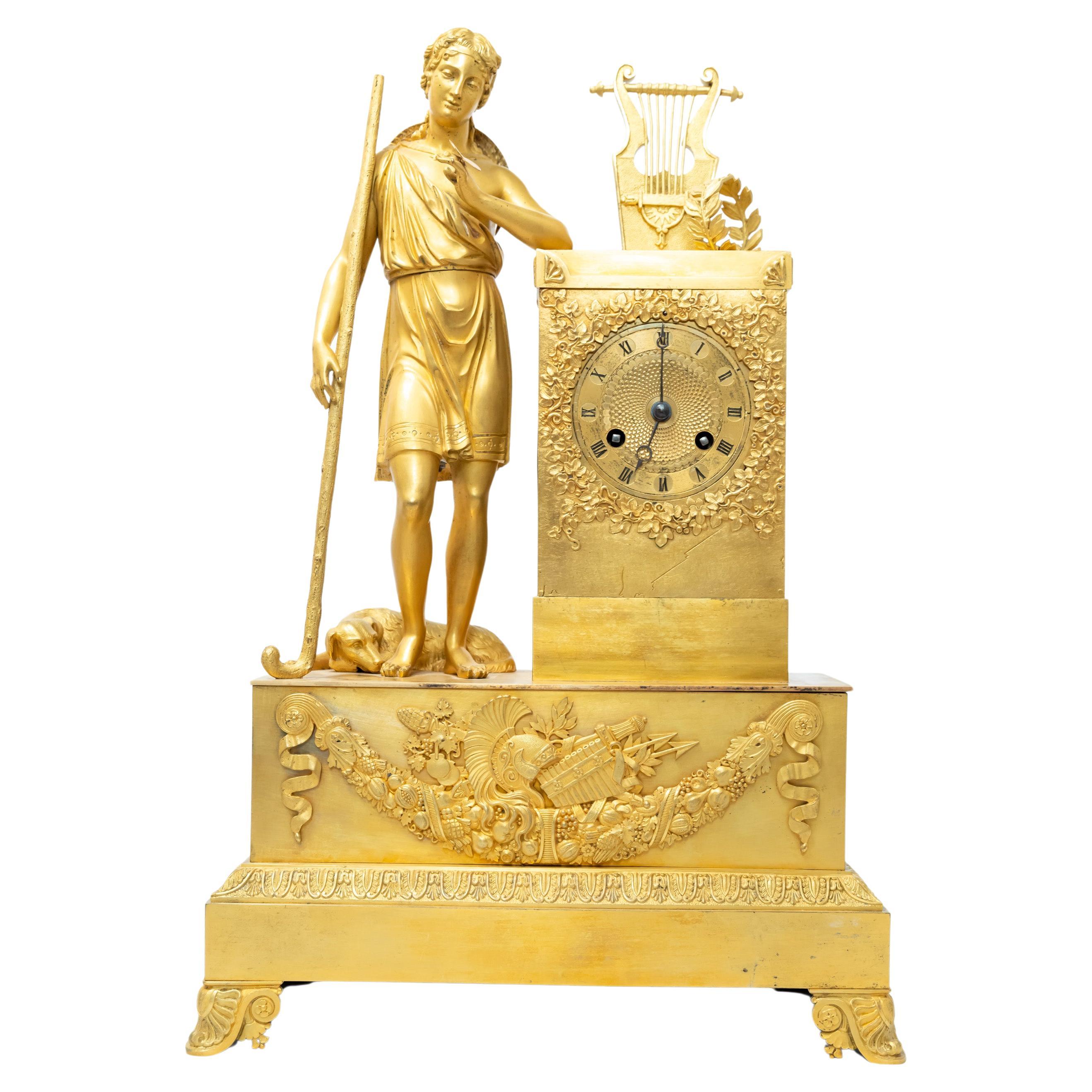 A French Fire-Gilt Bronze Restauration-Era Clock Featuring the “Shepherd Paris” For Sale