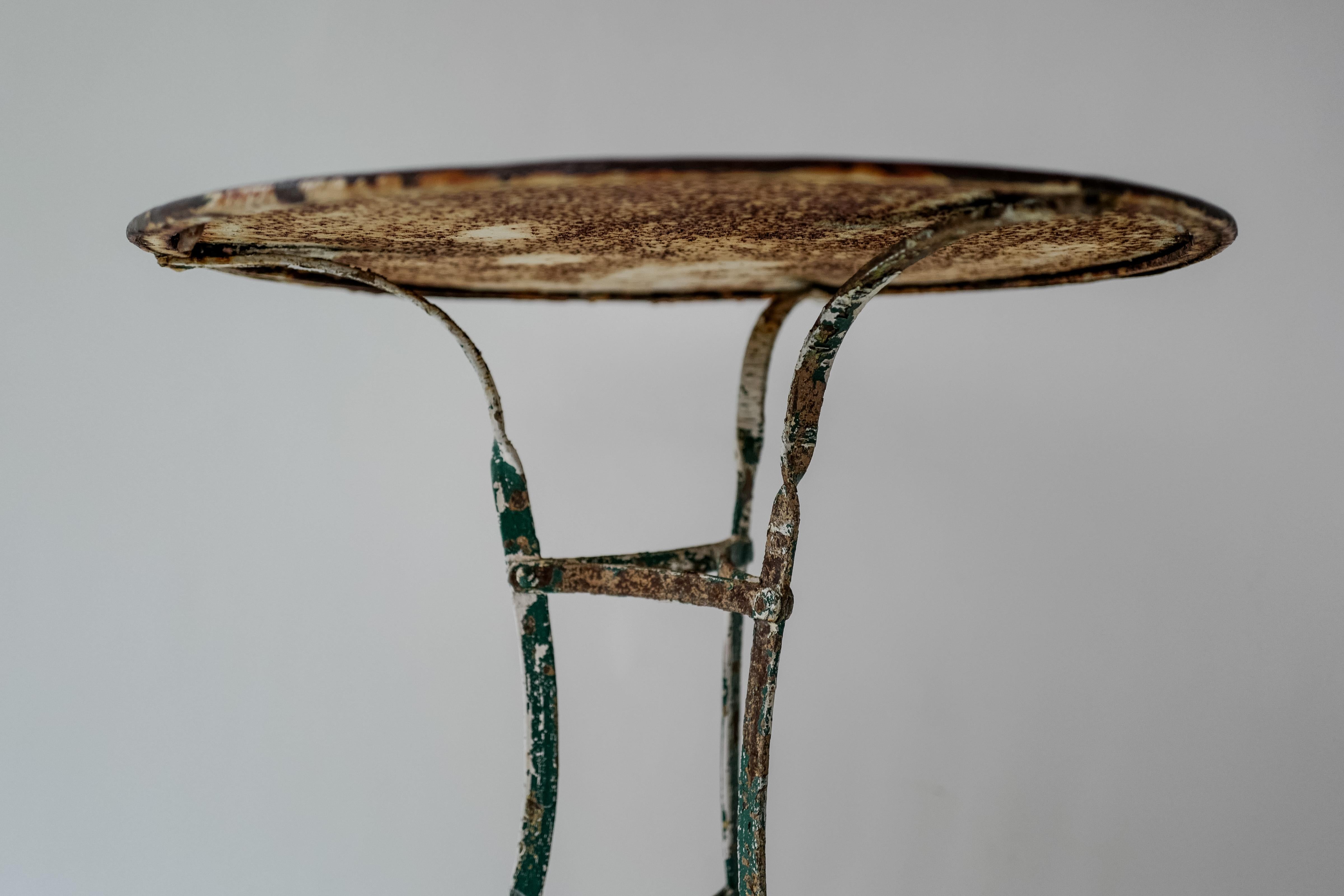 19th Century Italian Firenze Iron Round Bistro Table or Garden Table with dark brown/green patina. Beautiful time worn patina. 