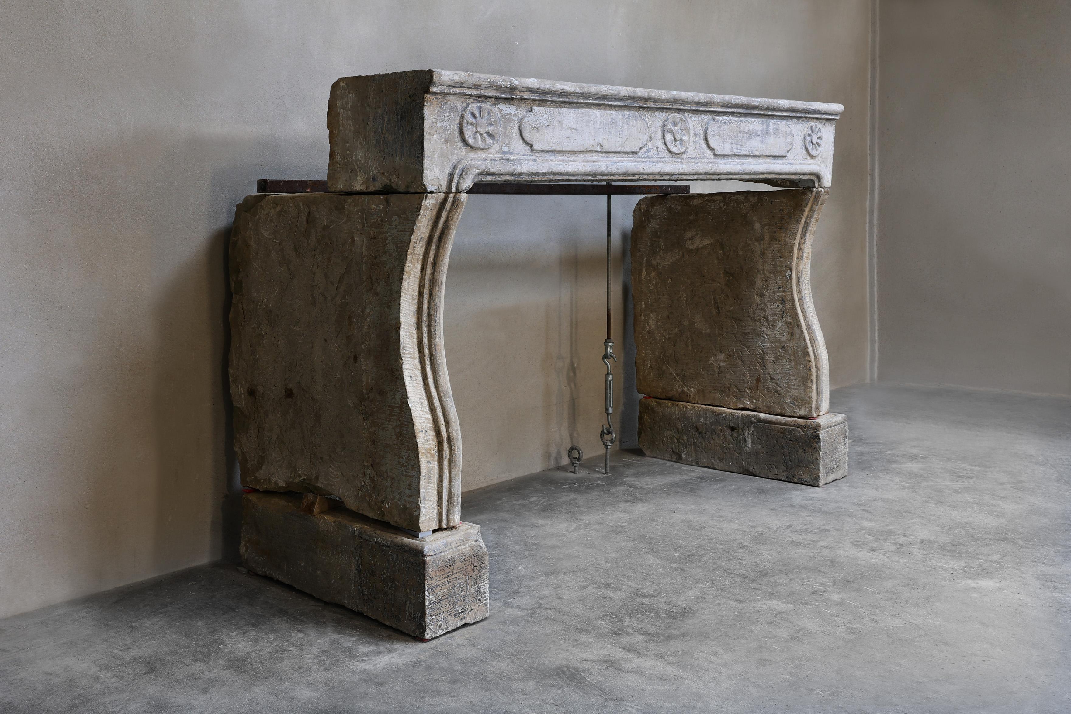 Special antique fireplace of French limestone! A fireplace with appearance and beautiful ornaments in the front part. This chimney dates from the 19th century and is in the style of Louis XIV.