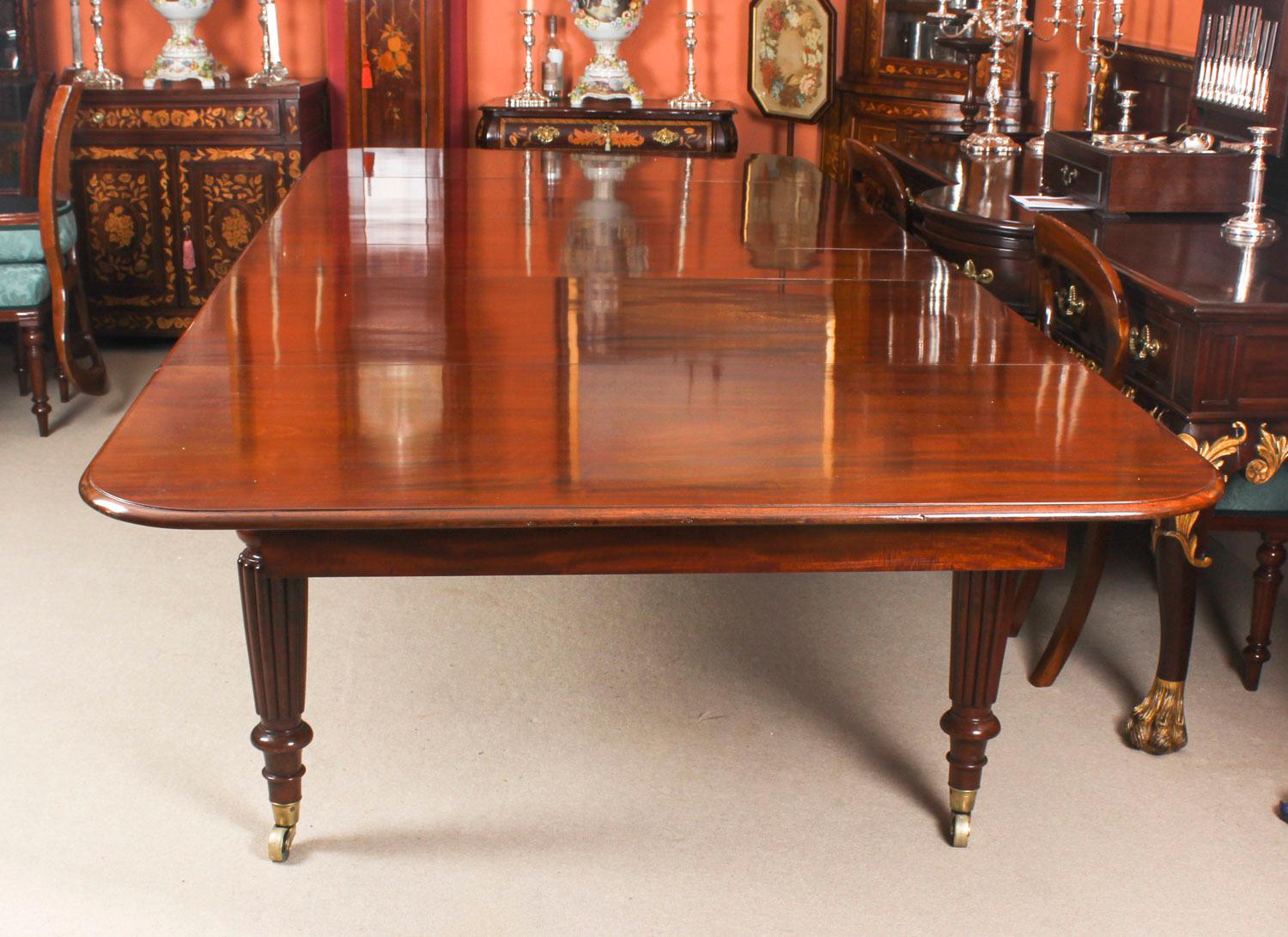 This is a superb antique early Victorian flame mahogany extending dining table, circa 1840 in date.

This amazing table can sit ten people in comfort and at a stretch up to fourteen. It has been hand-crafted from solid flame mahogany which has a