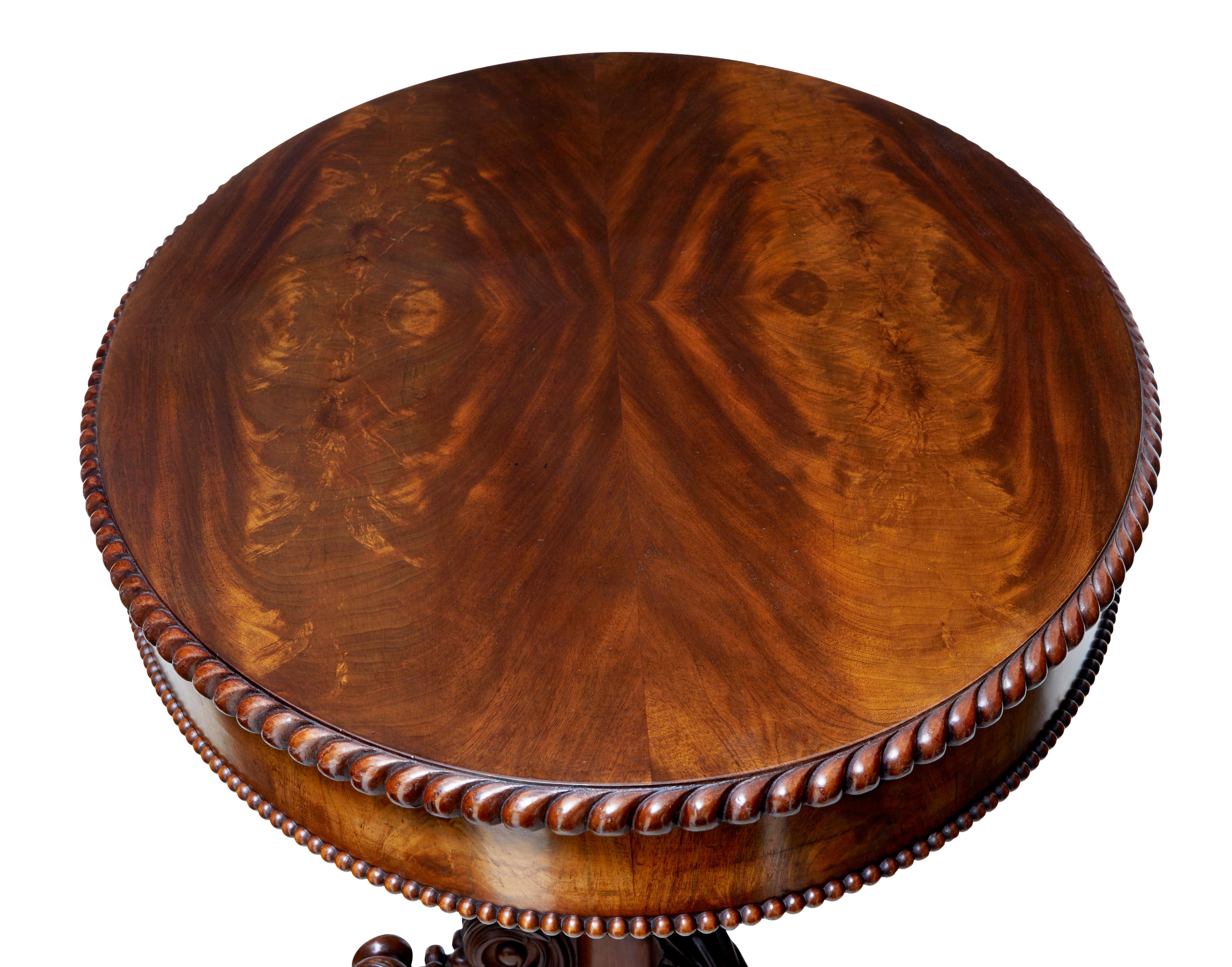 Carved 19th Century Flame Mahogany Oval Center Table