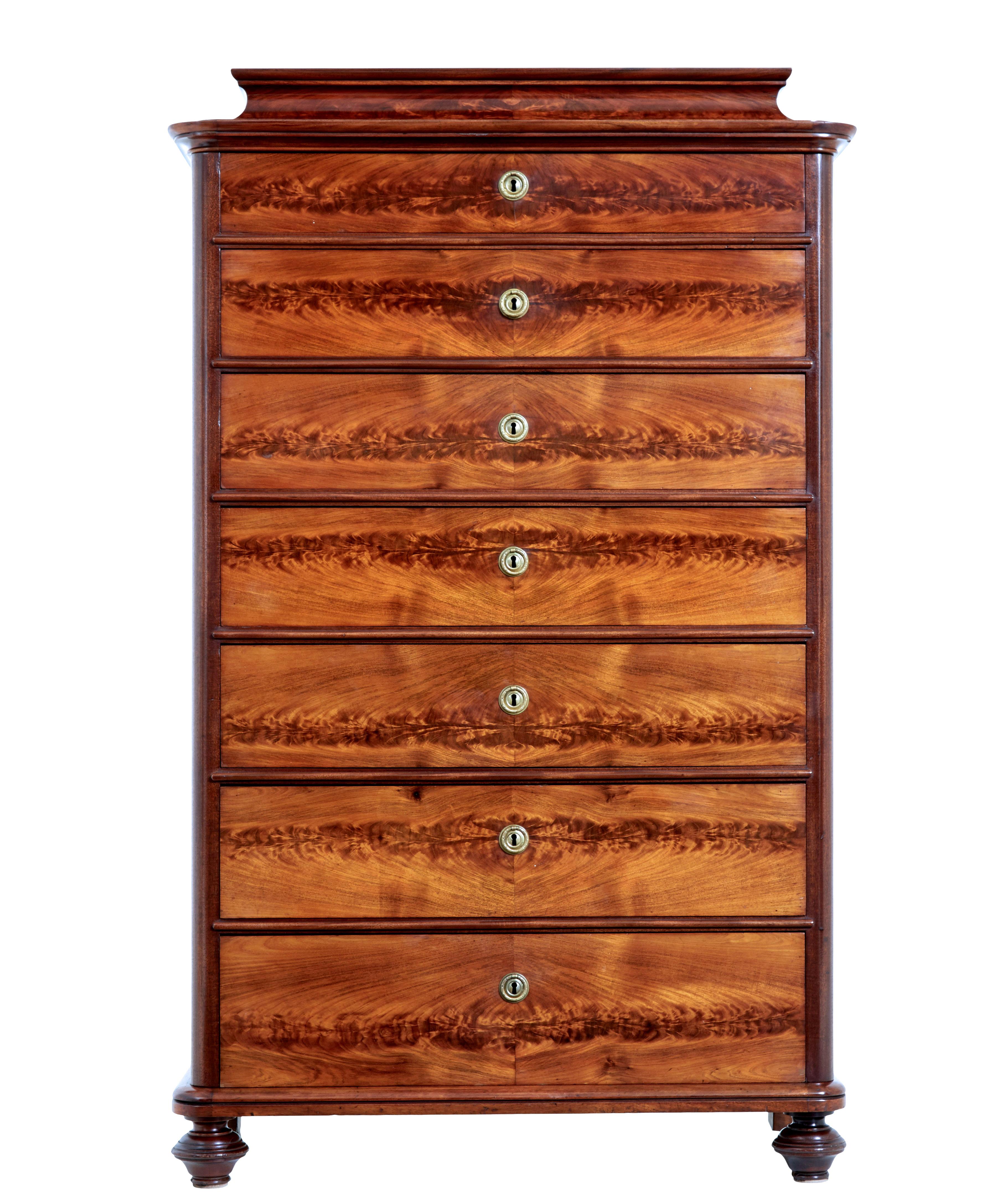 19th century flame mahogany tall chest of drawers circa 1870.

fine quality caddy top tall chest of drawers, which is also known as a seminere chest, because of the use of 7 drawers.

Made using mahogany and flame mahogany veneers. Caddy shaped