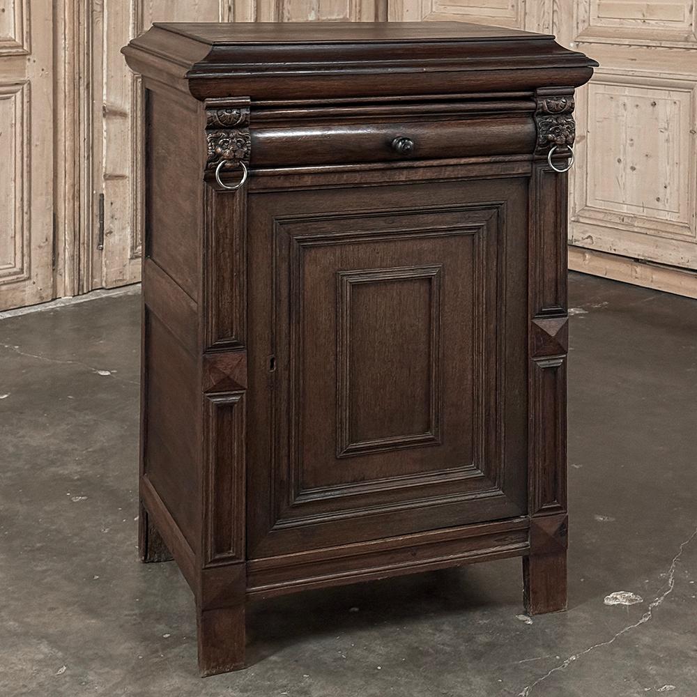 19th Century Flemish Cabinet ~ Confiturier features tailored lines accentuated by the top surface which is surrounded by flared out, then flared in molding for a dominant presence.  Lions' heads appear on the corners just under the top, each holding
