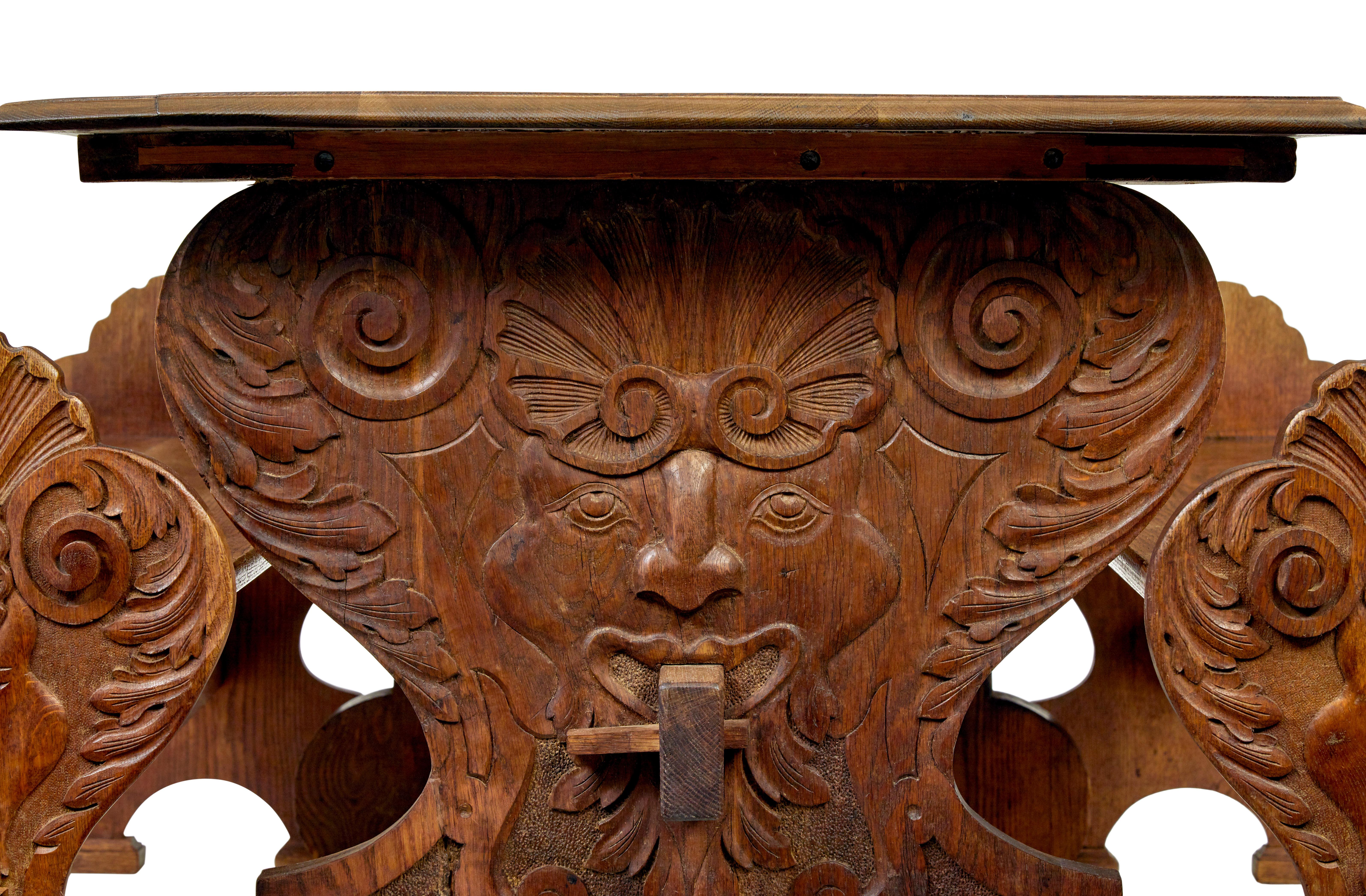 Belgian 19th century Flemish carved oak green man dining table and benches