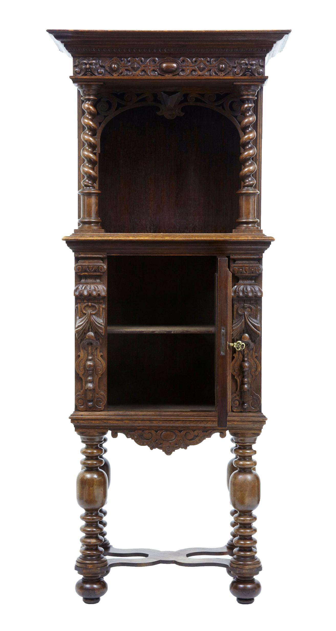 19th century Flemish carved oak hall cupboard on stand, circa 1870.

Fine quality Victorian oak hall cupboard, incorporating older carved elements. Main feature of this unusual piece is the carved Adam and eve panel on the door. Comprising of 2