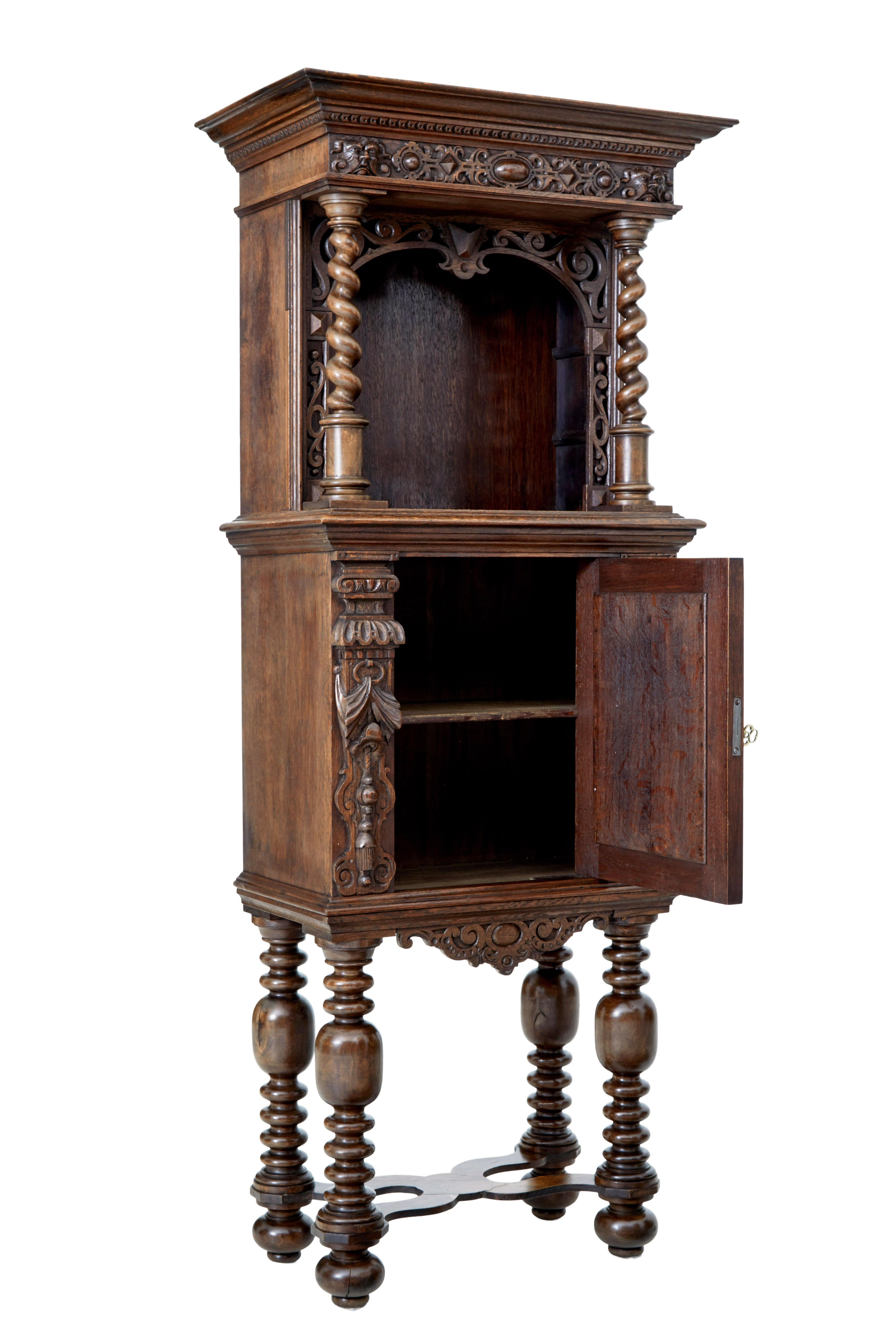 19th century flemish carved oak hall cupboard on stand, circa 1870.

Fine quality victorian oak hall cupboard, incorporating older carved elements. Main feature of this unusual piece is the carved adam and eve panel on the door. Comprising of 2