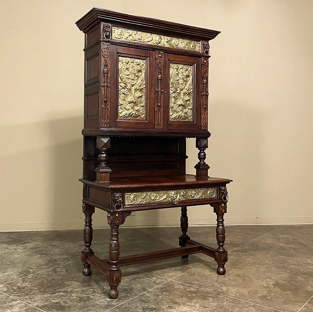 19th Century Flemish Louis XIV secretary or bookcase with embossed brass combines the talents of a master furniture crafter with the artistry of a metal sculptor! Fashioned with a classical architecture that includes bold crown molding, turned