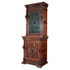 19th century Flemish oak and stain glass cabinet