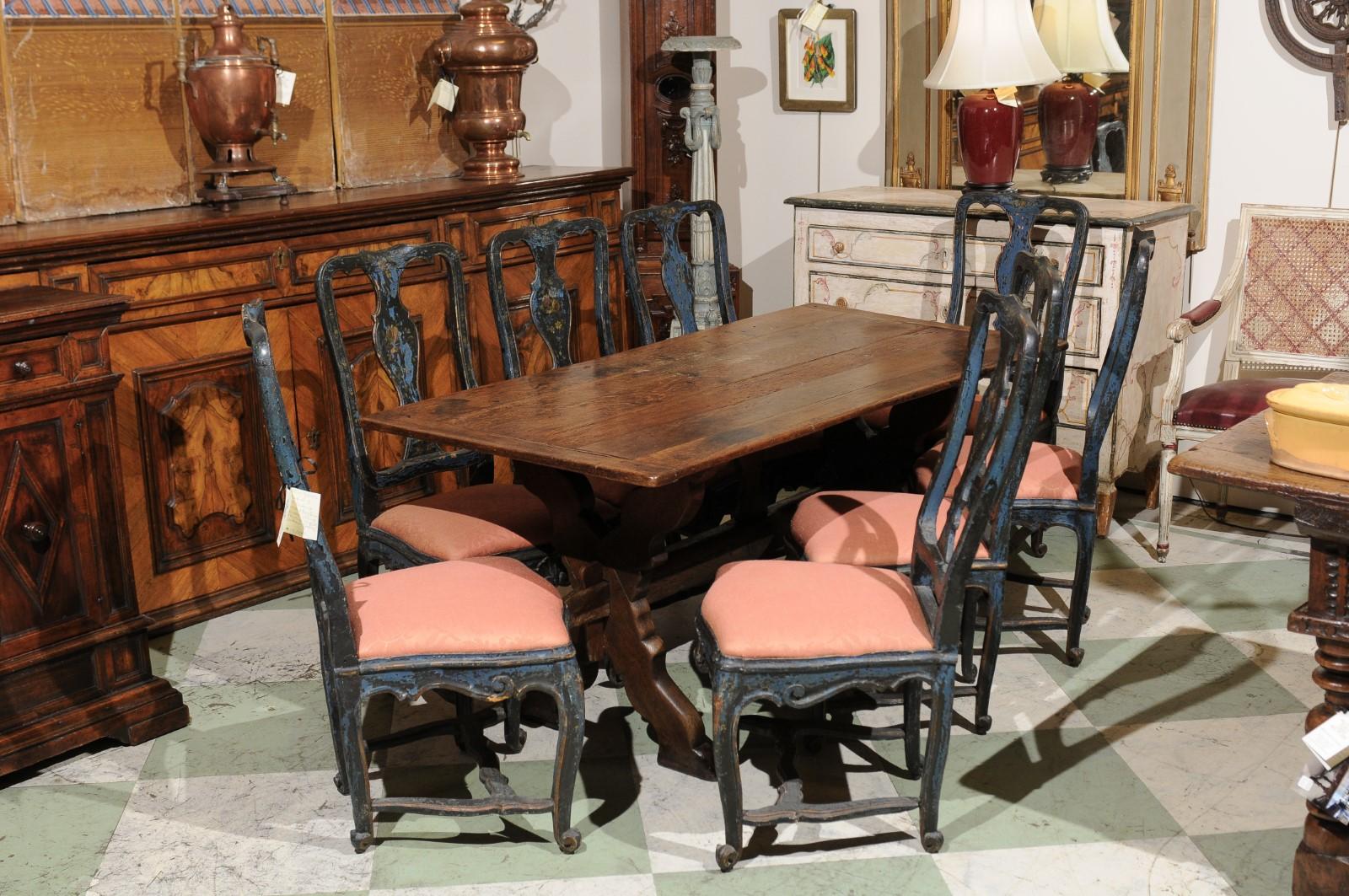 A 19th century Flemish oak trestle dining table with X-leg and stretcher.