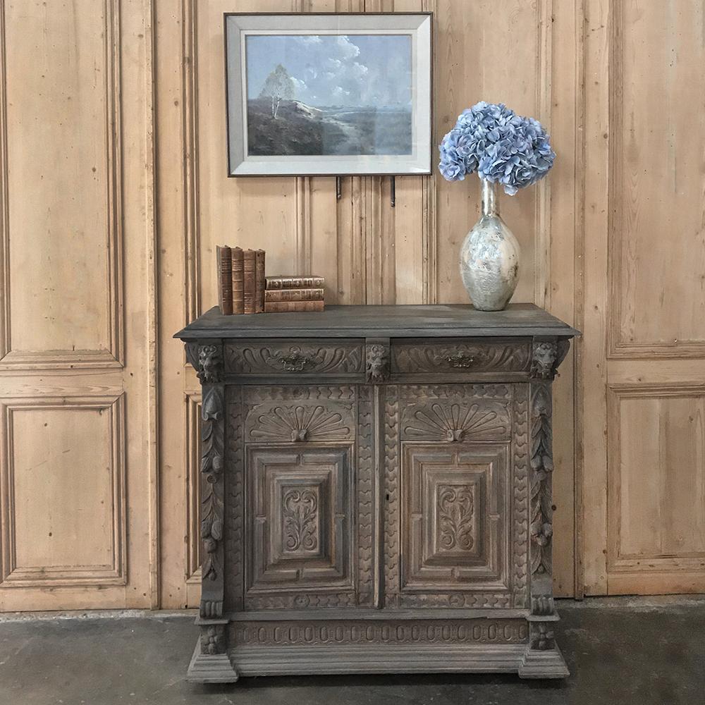 This 19th century Flemish Renaissance oak buffet was handcrafted from solid old-growth oak and features a stripped and patinaed finish making it an excellent choice for the casual decor! hand carved lions, cast brass pulls, extraordinary molded