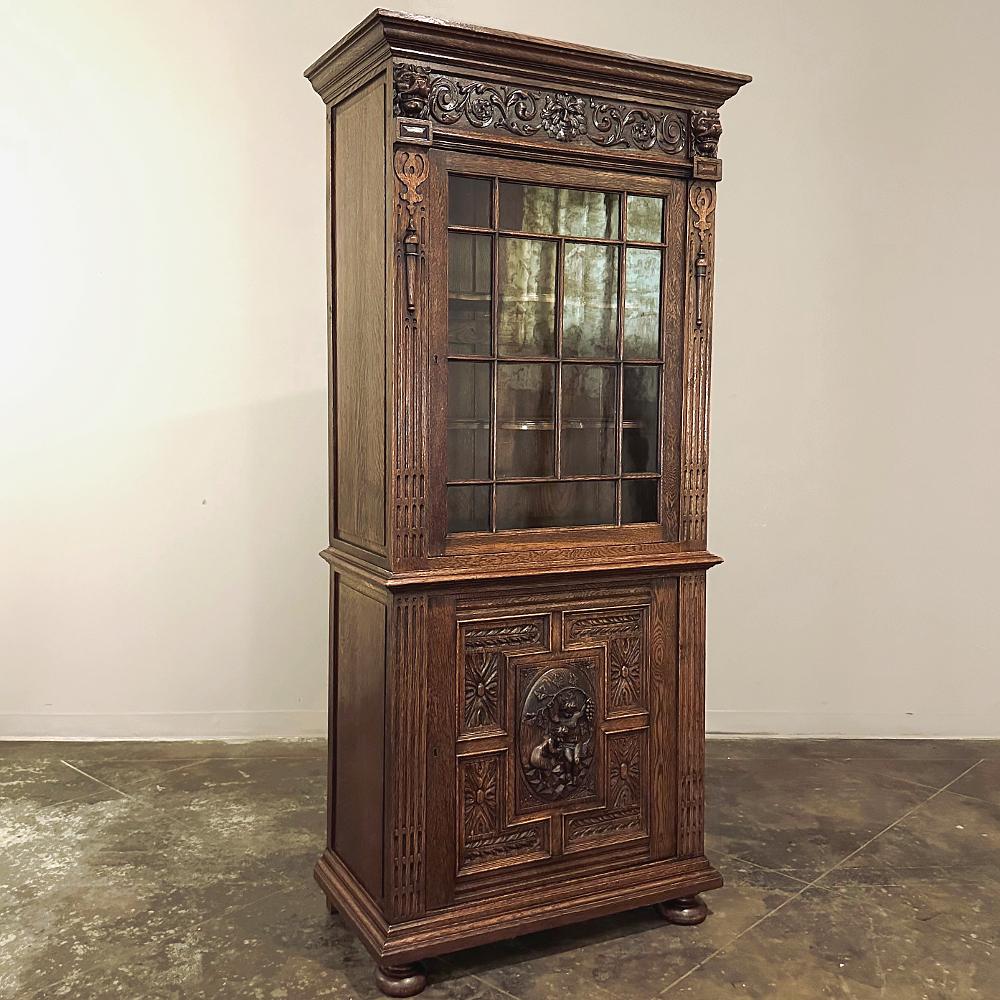 19th century Flemish Renaissance Revival Bookcase represents the essence of the revival of classical architecture melded with carved ornamentation that celebrates the beauty of life and bounty of the earth. handcrafted from solid old-growth oak, it