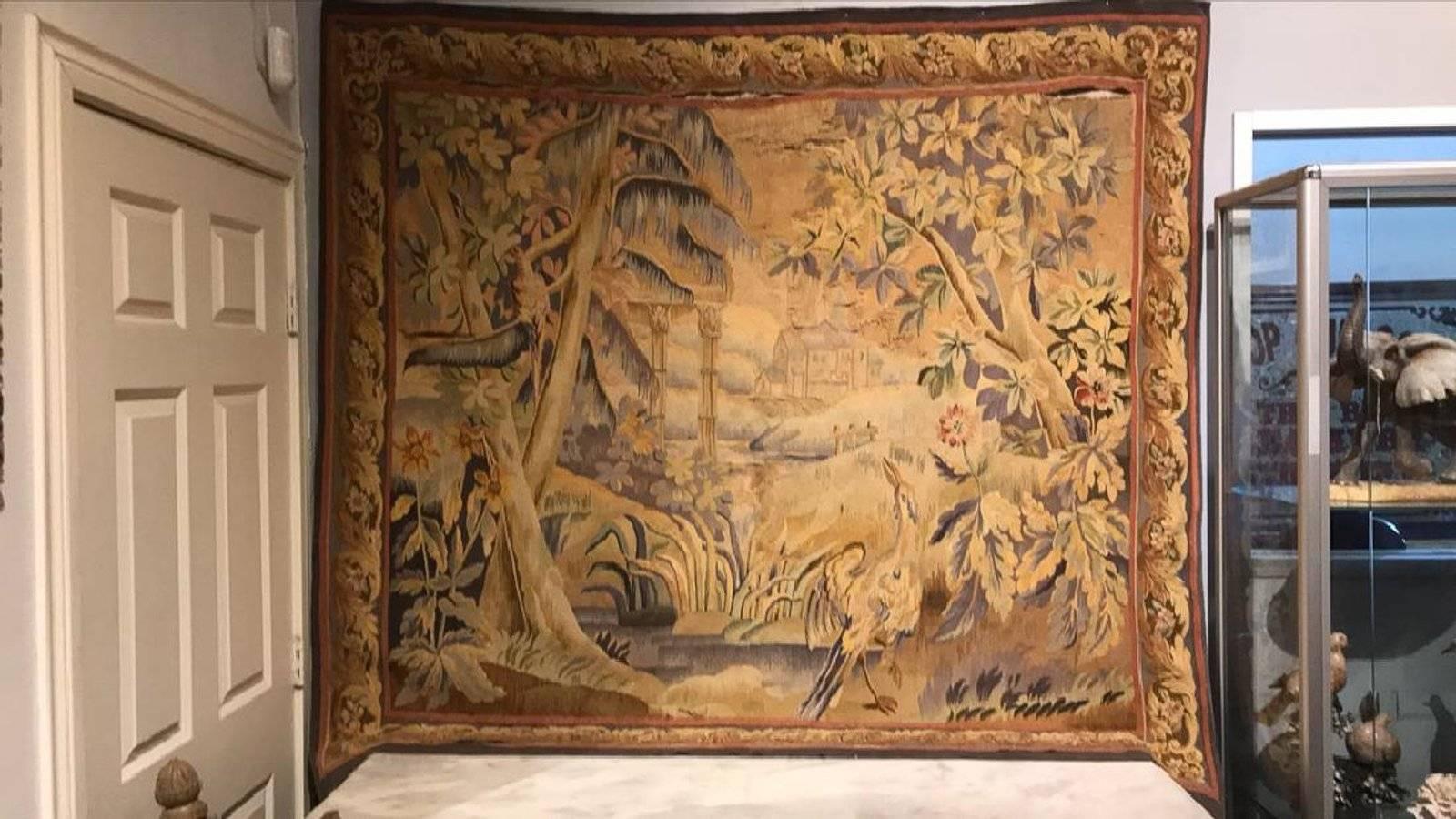 Superb 19th century Flemish handwoven tapestry with a scenic depiction of a flowering landscape with river and exotic birds. A view of a castle can be seen in the distance, 

circa 1870

Good condition but needs some seams re-sewn as shown in