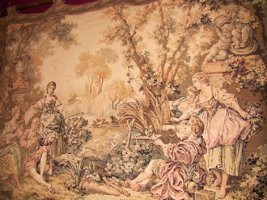 Really nice Continental wall tapestry from the mid-19th century, circa 1860.
In great condition.
Country scene featuring ladies and gentlemen in period attire fishing and having a picnic by a stream, surrounded by Garden Statuary of Decorative