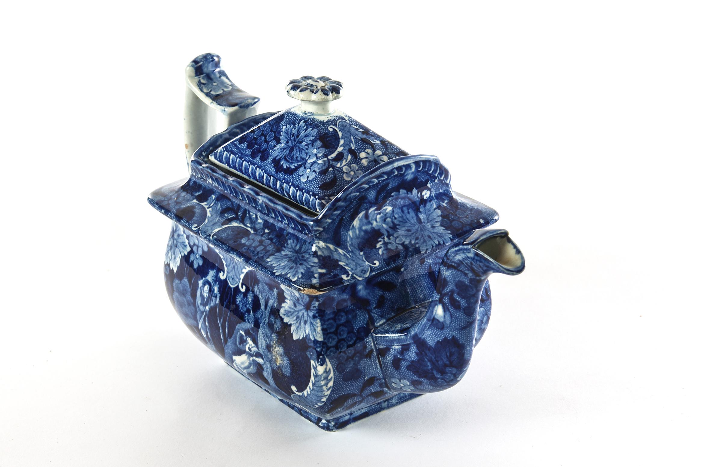 A charming teapot in the popular Victorian Era Flo Blue. This teapot features generous proportions on handle, body and elongated spout with a sweet little flora form finial. In very nice antique condition with just one small chip that does not deter