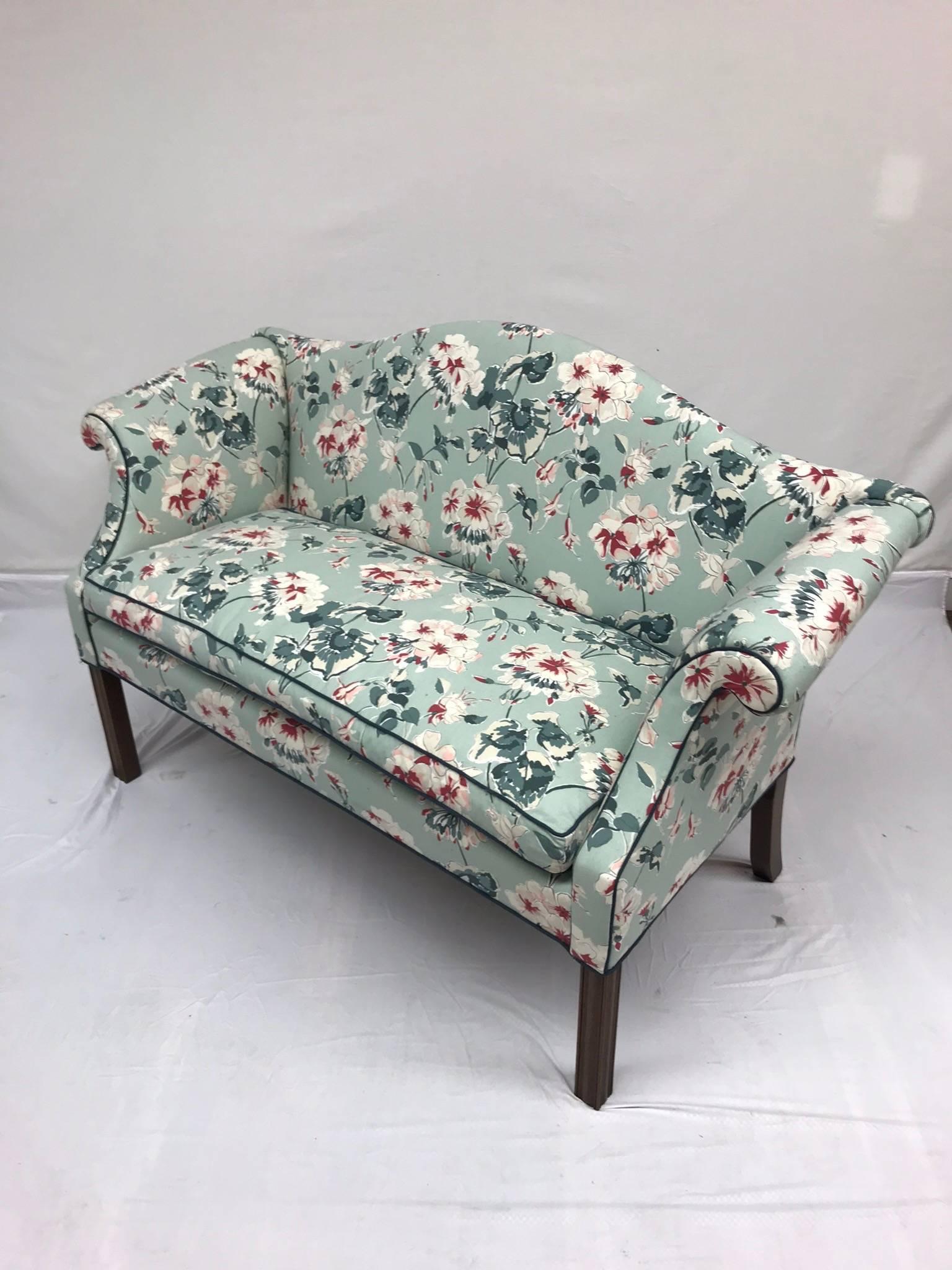A charming and super-comfortable 19th century settee newly upholstered in our workshop for Robert Allen Mirador Morn fabric in Celadon paired with a rich blue welt. We unearthed this stunner at a Christies Auction in London. Rolled arm, wood legs.