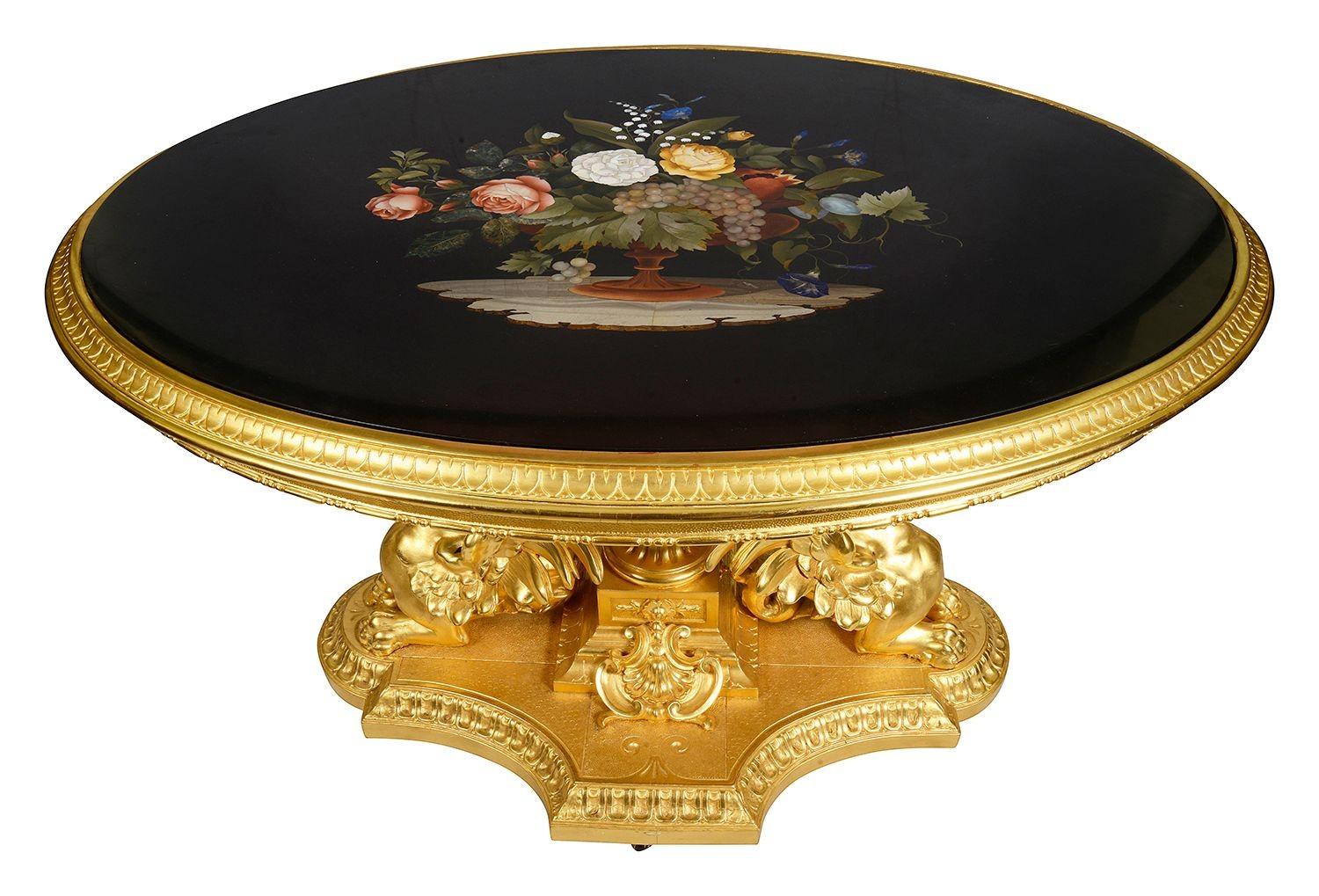 This exquisite Italian 19th-century centre table features a Florentine carved giltwood frame and stunning Pietra dura marble inlay top. The ornate design showcases intricate floral motifs, beautifully crafted in vibrant colours on a black marble