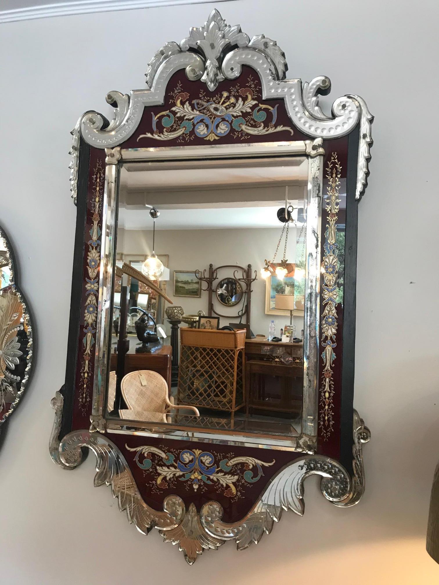 Rare and spectacular 19th century Napoleon III period Venetian mirror.
enameled painted flowers and musical instrument on the red glass.
Very elegant work. Beveled mirror on the center.
One minor glass damage on the left bottom glass ornament but
