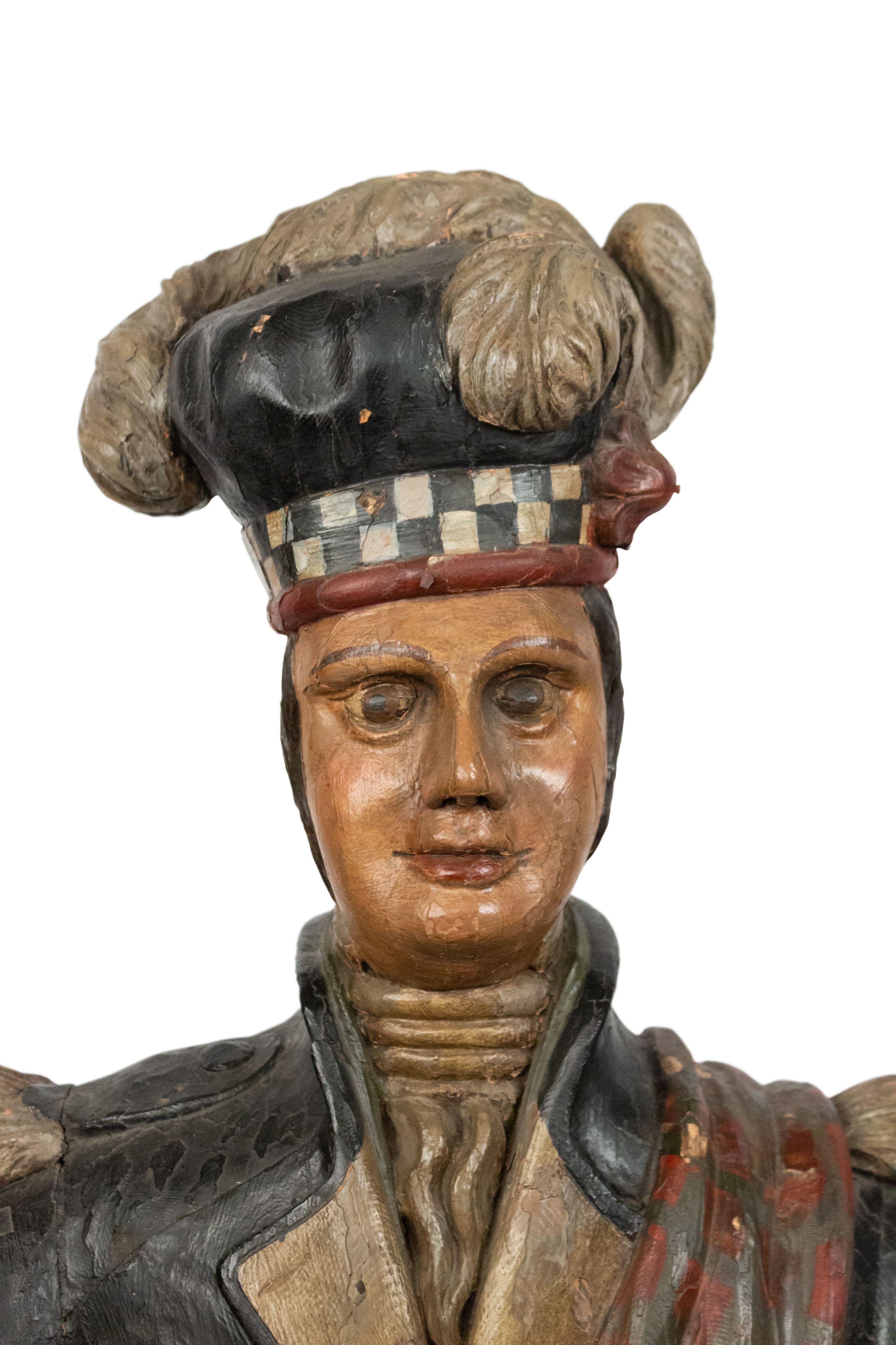 19th century Scotsman (Highlander) Carousel large carved and painted standing figure wearing kilt with plume hat on large round base.