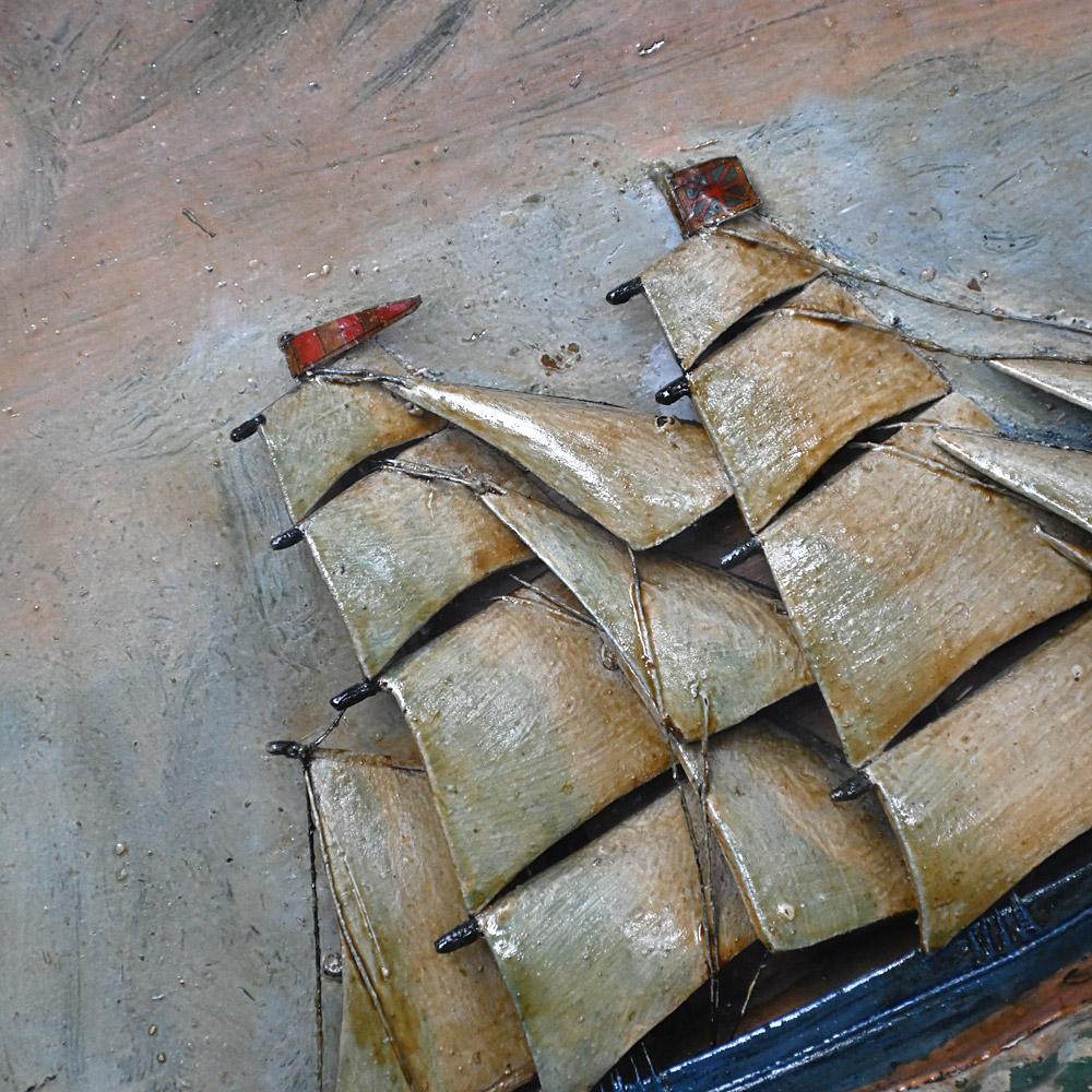 19th Century Folk Art Hand Painted Ship Diorama  

A delightful piece of 19th Century English nautical folk art, in the form of an encased ship diorama with hand painted detail. Including sky, sea and land with light house. The case is wider at the