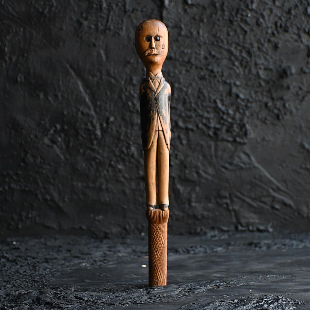 19th Century Folk art Priests Cosh

A rare object in the form of a 19th Century folk art priests’ cosh. With hand carved detail in the form of a man in tunic. With worn hand painted detail and a well-crafted hand carved hand. With one glass eye this