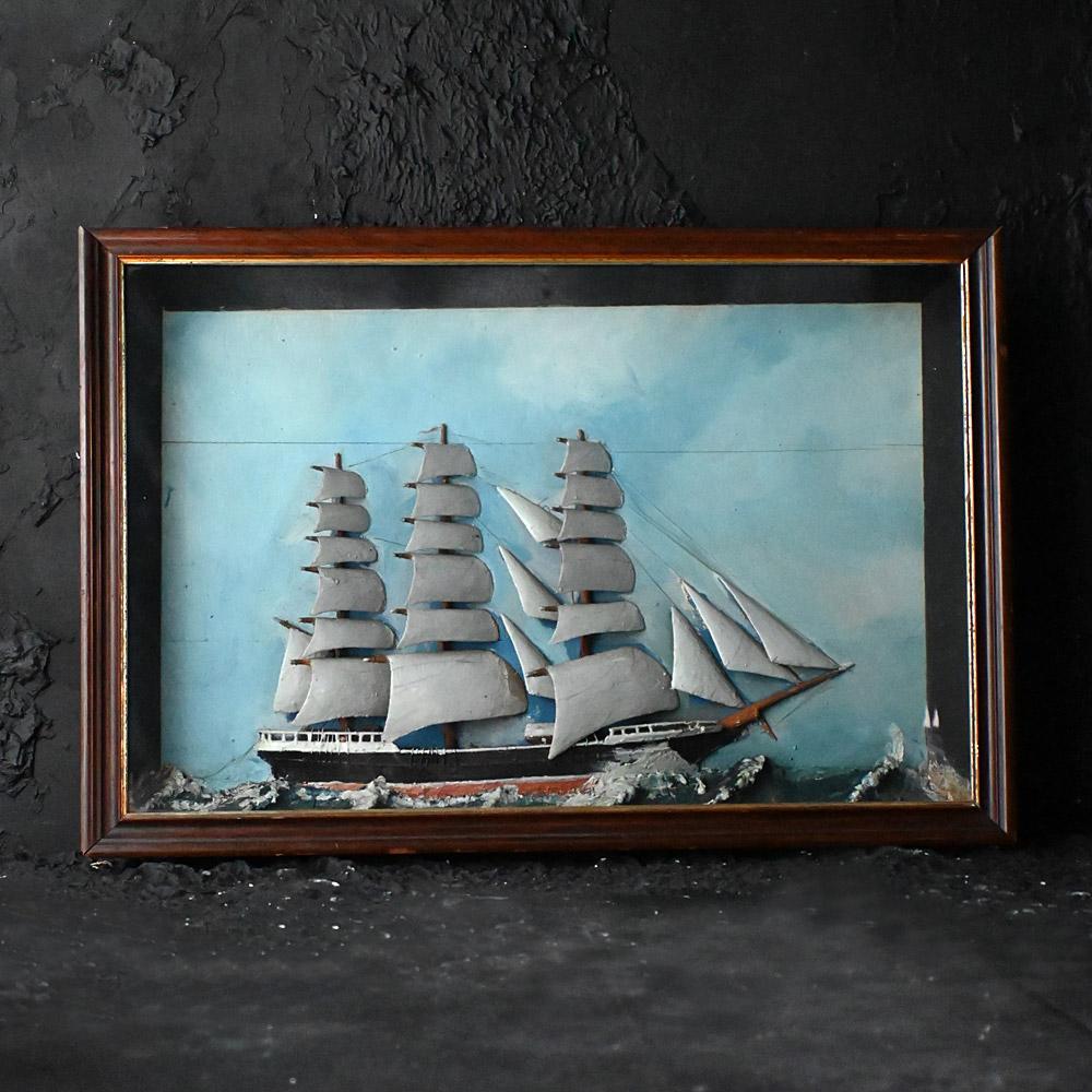 19th Century Folk-art Ship Diorama 

A highly decorative piece of English nautical folk art, in the form of a carved wooden ship displayed in a bespoke glass fronted diorama. The ship is completely made from sections of wood with painted detail.