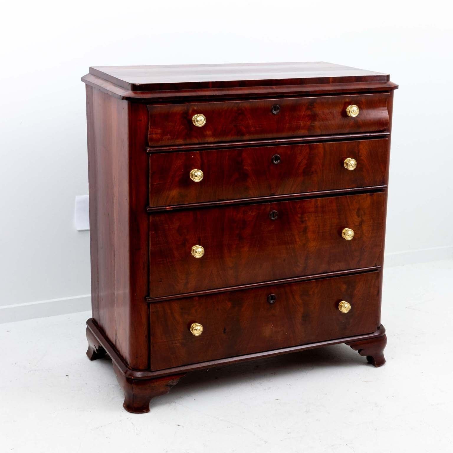 Circa 19th Century four drawer commode. The piece is mahogany with brass pulls in the French empire style.
