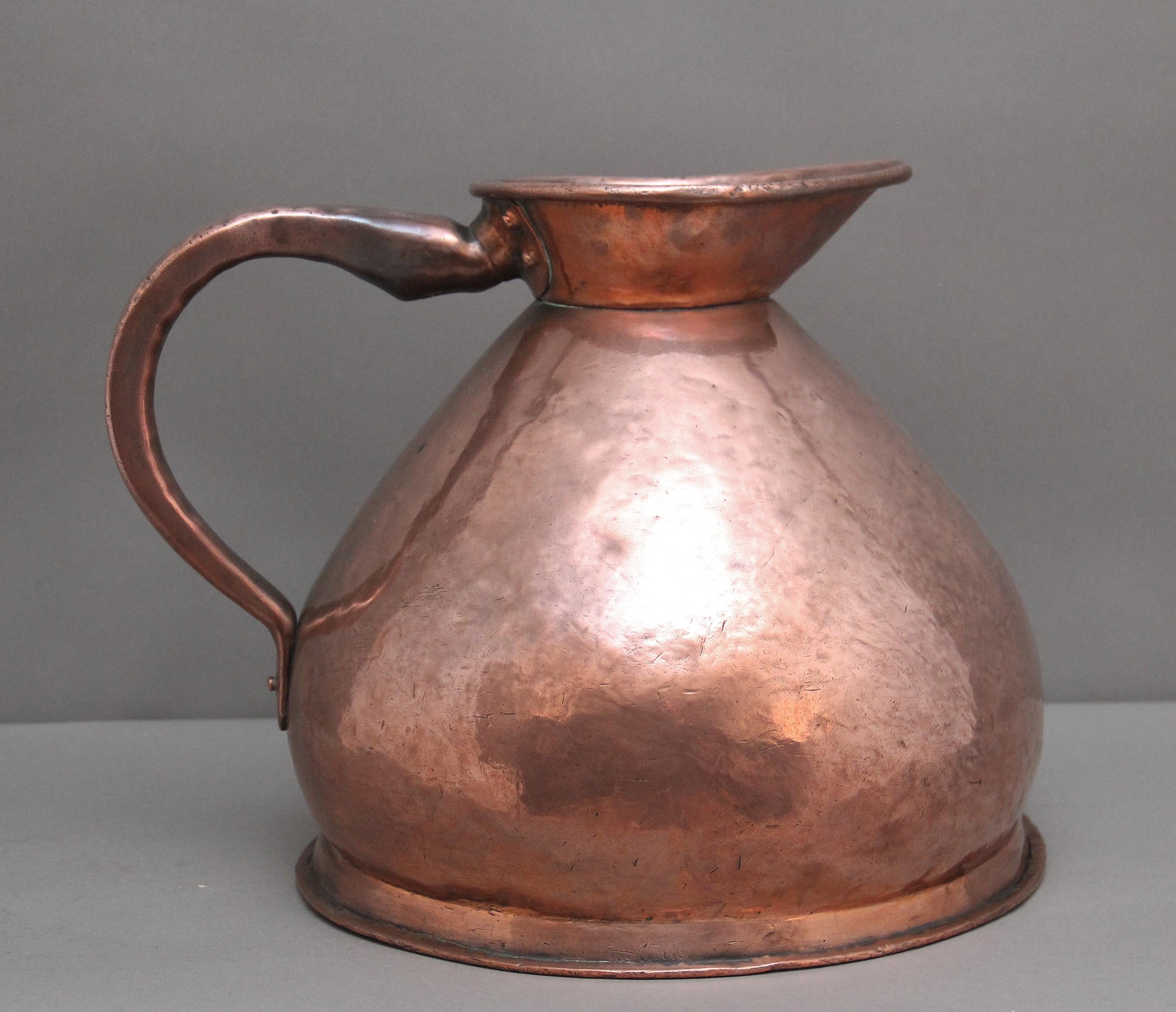 19th Century four gallon copper haystack measuring jug in very good condition and marked at the front with four gallon, having a large shaped handle to one side, the haystack jug named for it's wide based form and having a large spout.  Circa 1870.
