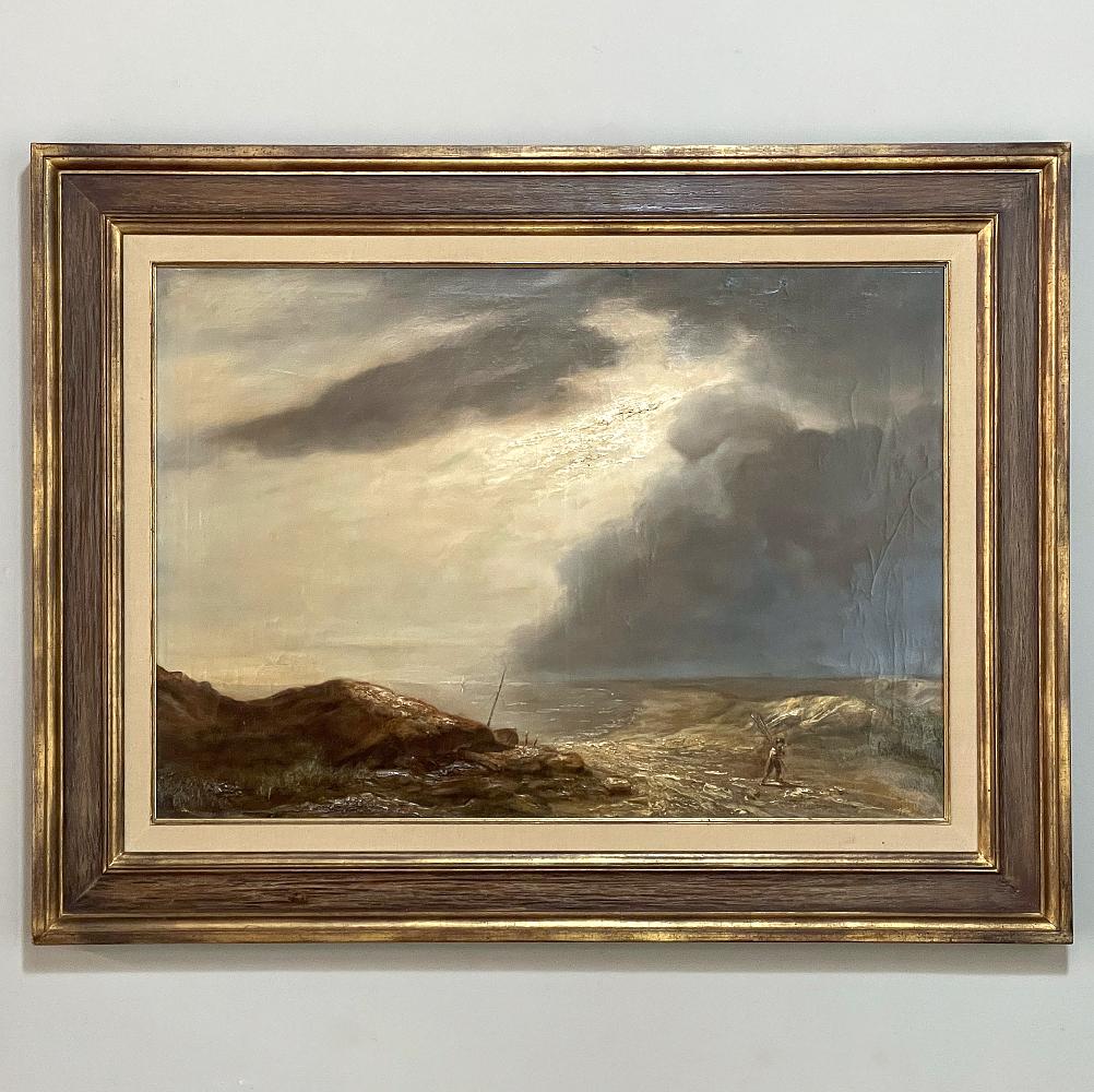 19th century framed oil painting on canvas is a majestic work that transcends the monochromatic palette to evoke an incoming storm, both representing the power of nature and man's struggle against incredible forces. The last glimmer of sunlight is