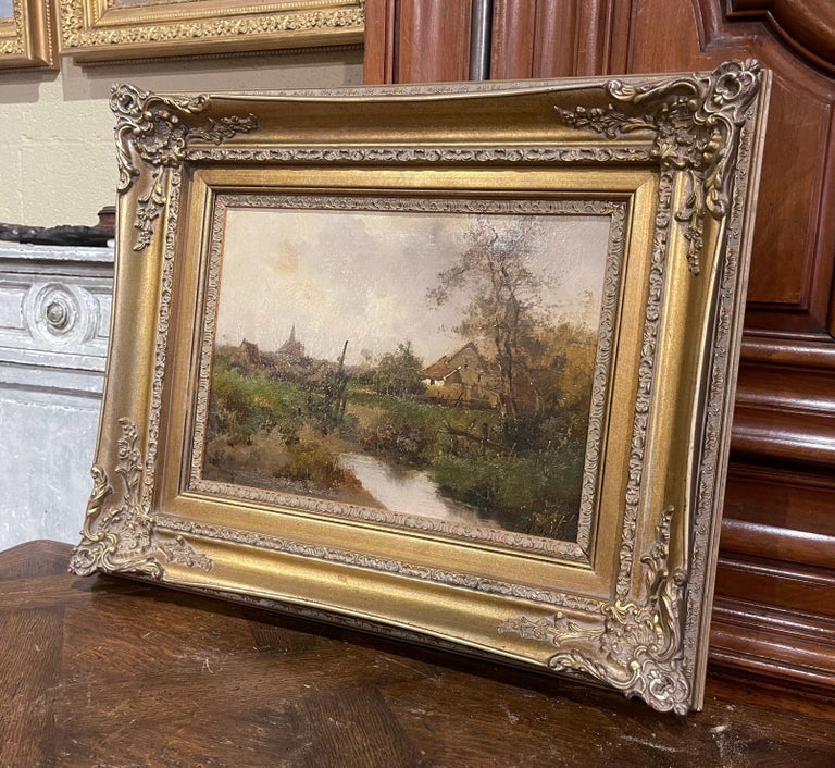 Decorate a study, living room or den with this beautiful and colorful antique oil on canvas painting! Painted in France circa 1890, the artwork is set in a carved gilt wood frame and illustrates a picturesque animated village in rural France in a