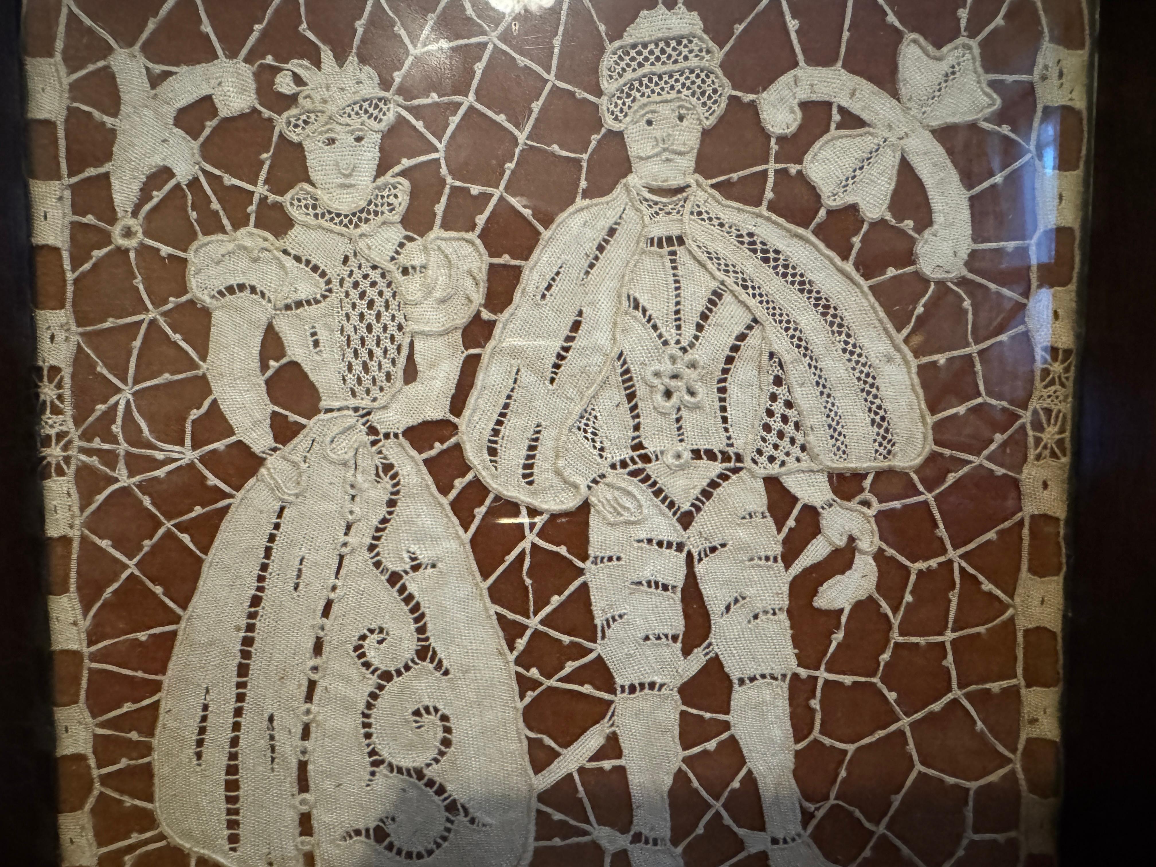 19th Century Framed Victorian Needle / Bobbin Lace artwork, likely to be Point de Gaze, depicting a couple in elaborate 18th-century-style clothing—likely inspired by Rococo or Georgian fashion. The figures are rendered in fine, off-white lace with