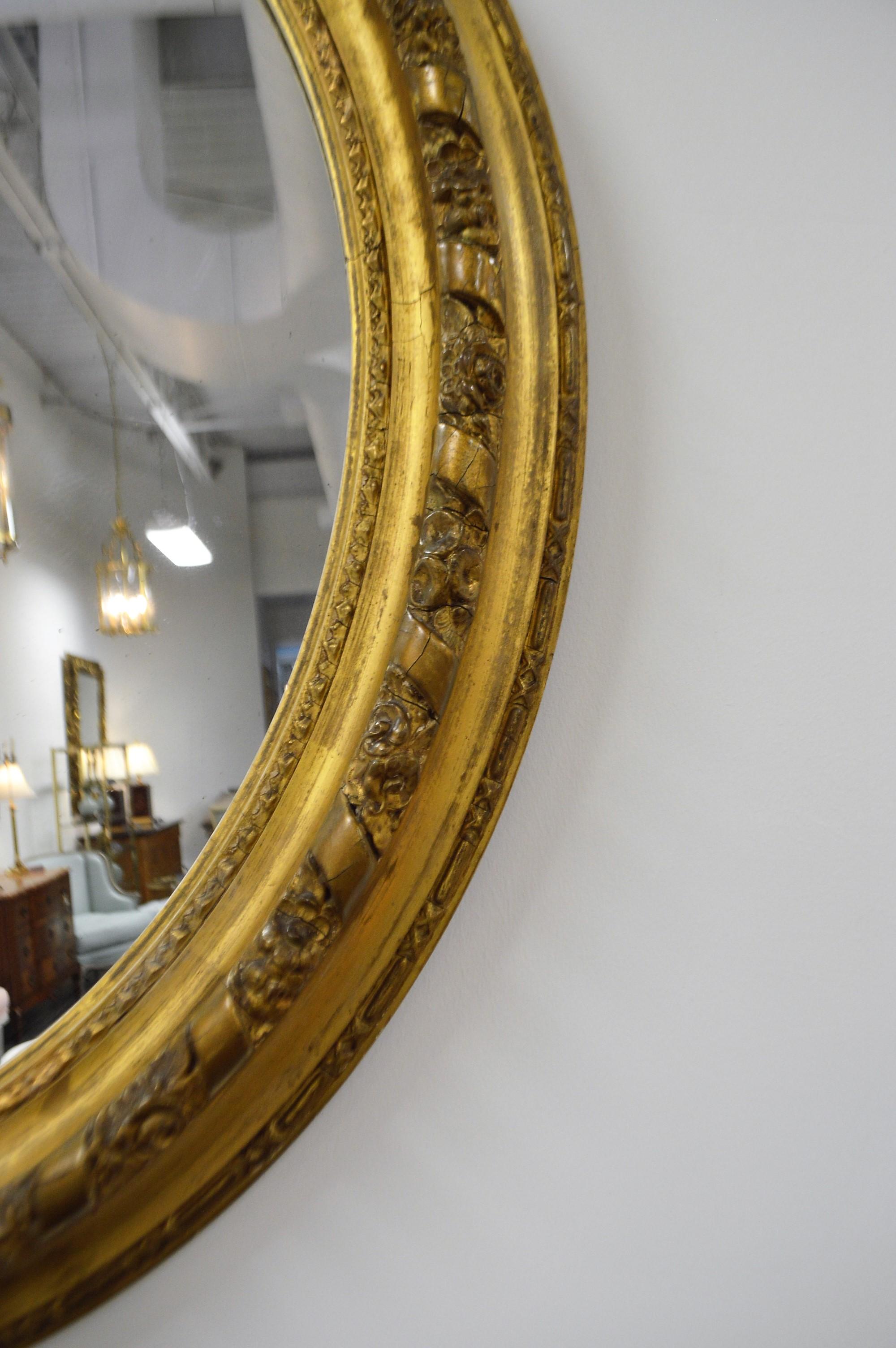 French 19th Century France Gilded Louis XV Style Oval Mirror For Sale