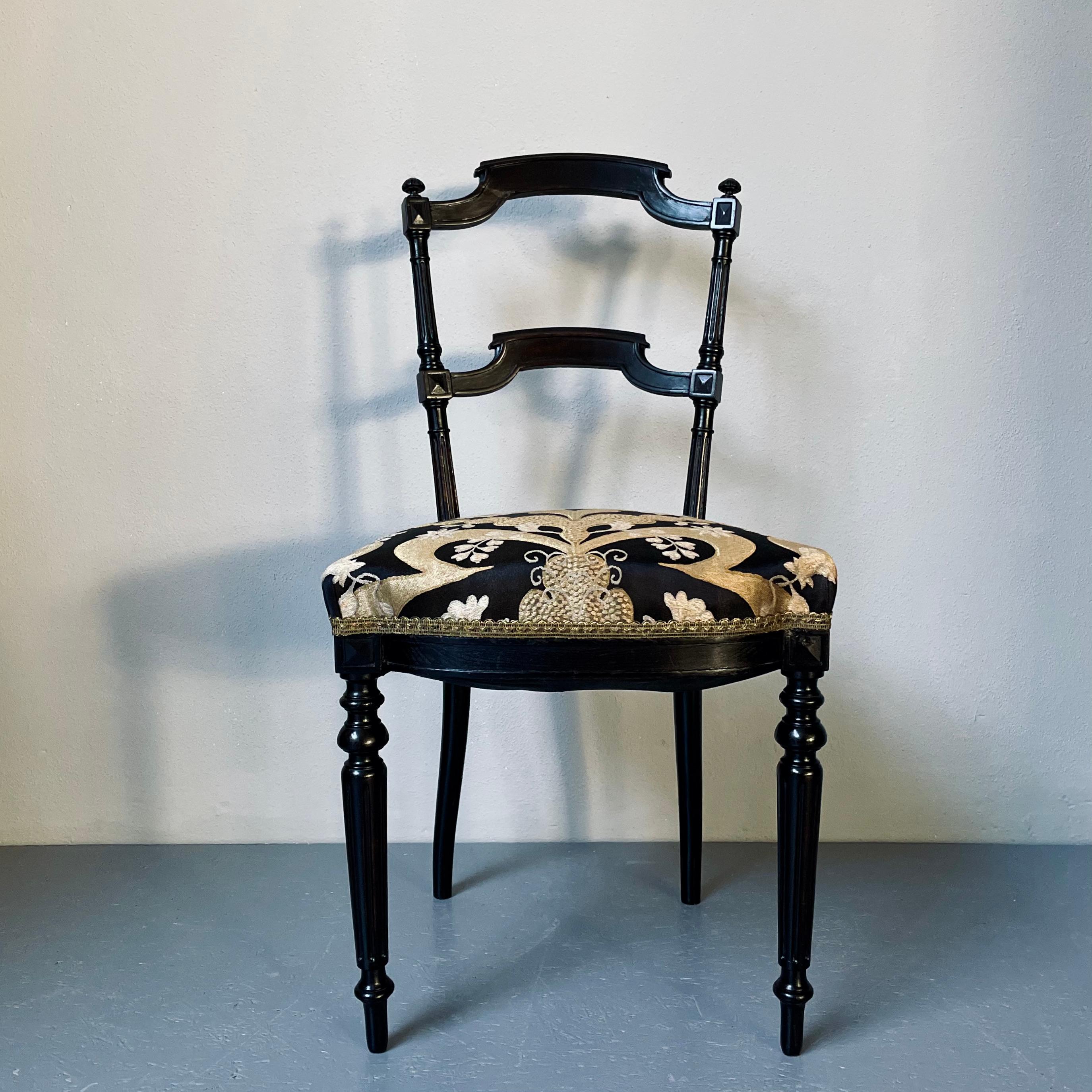 This 19th Century French parlor chair has been restored and given a beautiful ornamental fabric. Its seat is firm and comfortable.
