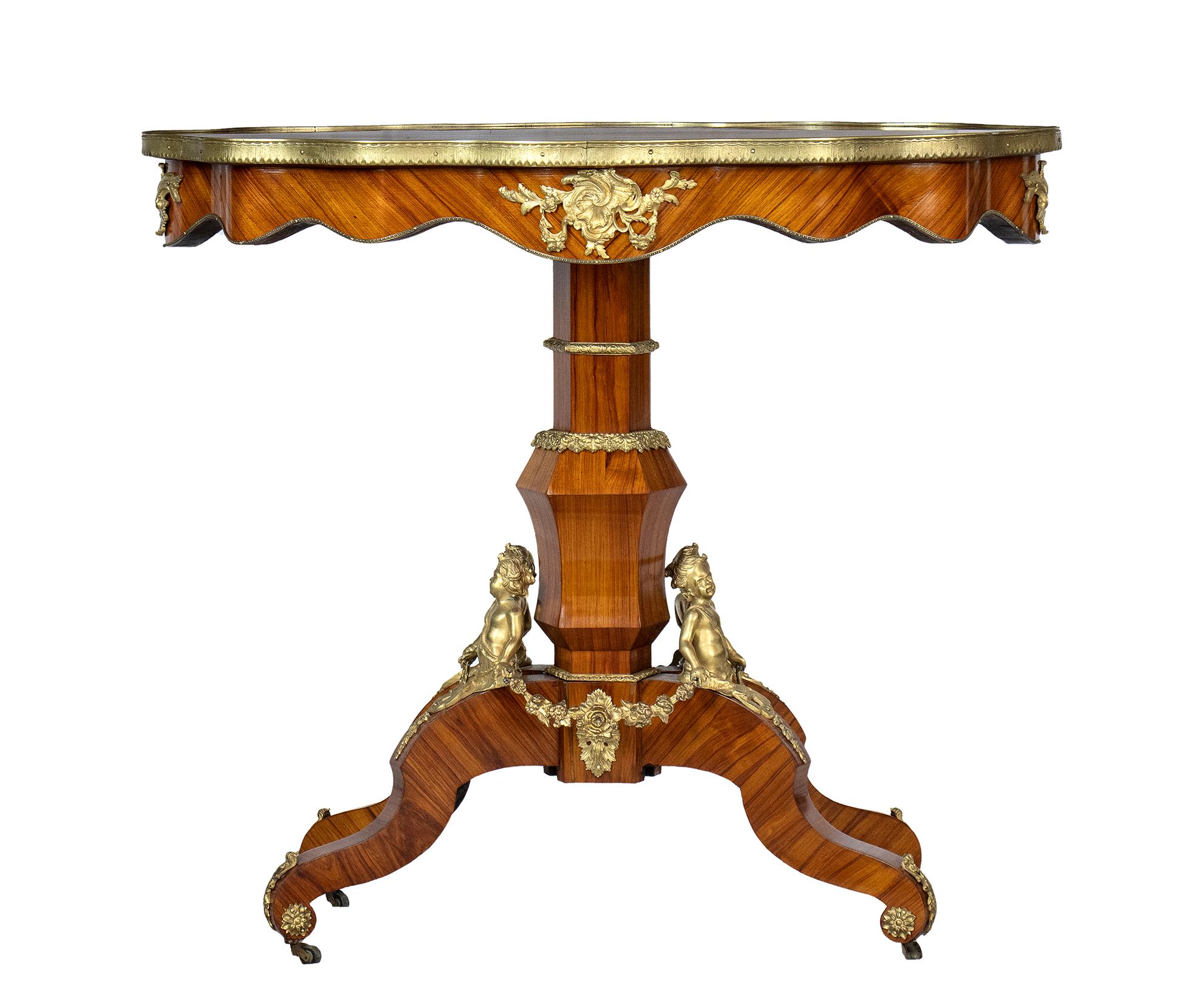 Center table, Napoleon III in purple ebony wood - French provenance,19th century era
Four-footed center-leg base surmounted by bronzes depicting putto busts holding interconnected garlands, top is surrounded by a bronze frame.
Height x width x