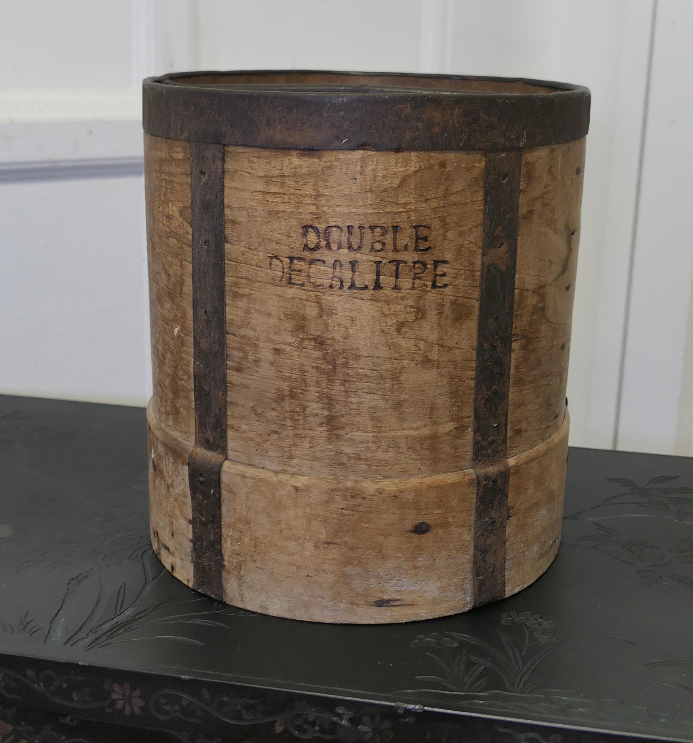 19th Century French 10 Litre Wooden Fruit Measure

This large measure is made in beech, it is cylindrical in shape with iron banding and central frame, it is in good used condition and would make a great kitchen display filled with fruit or