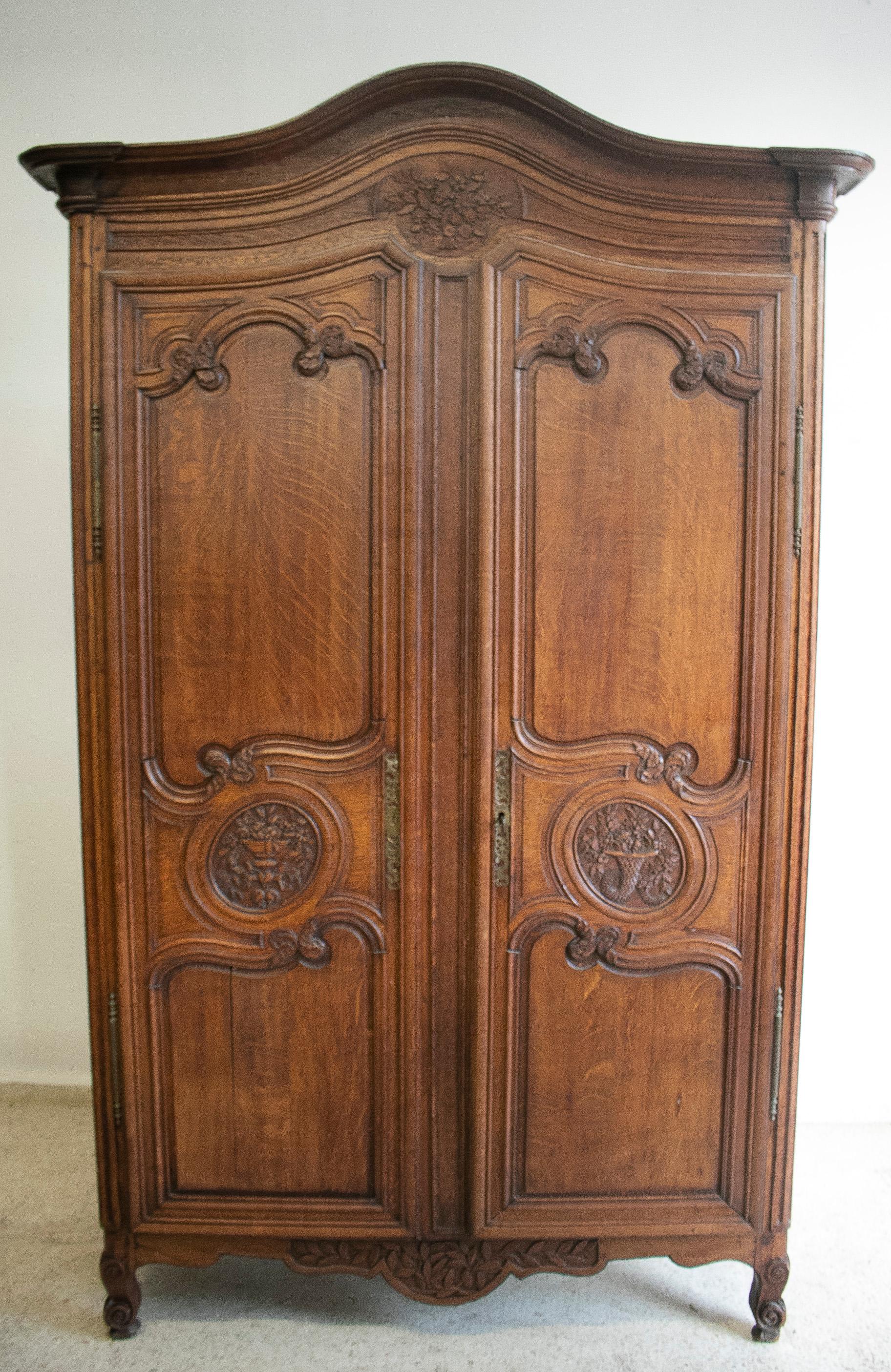 Antique 19th century French 2-door wooden wardrobe.