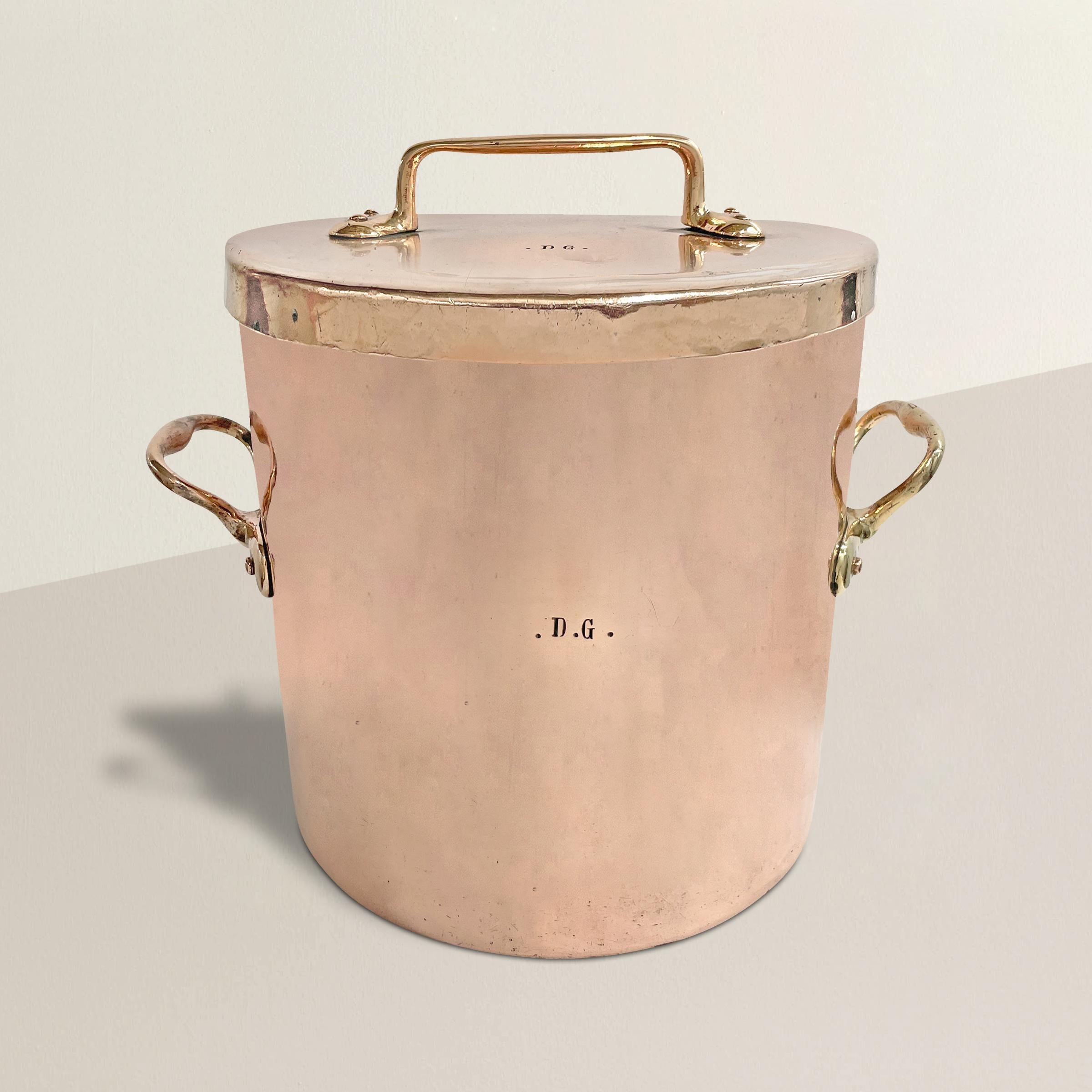 A fantastic large 19th century French copper stock pot that holds 21 quarts of liquid, dovetailed joints running the length of one side, and with a tight fitting lid that fits over the rim which allows the pot to be used as a roaster was well.