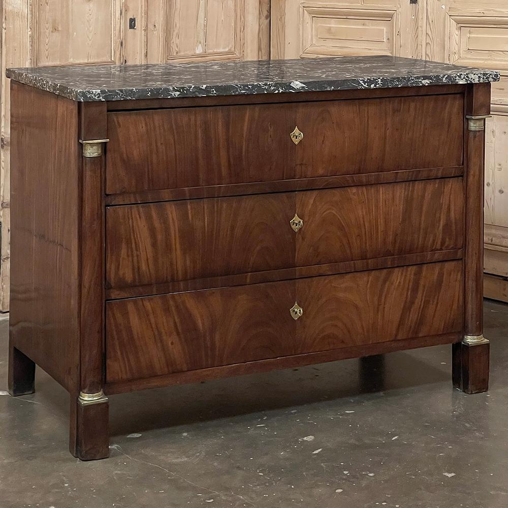 19th Century French 2nd Empire Mahogany Marble Top Commode was crafted during the Napoleon III period, when all the major French styles were revived, especially the one that gained prominence during his uncle's reign at the turn of the 19th century.