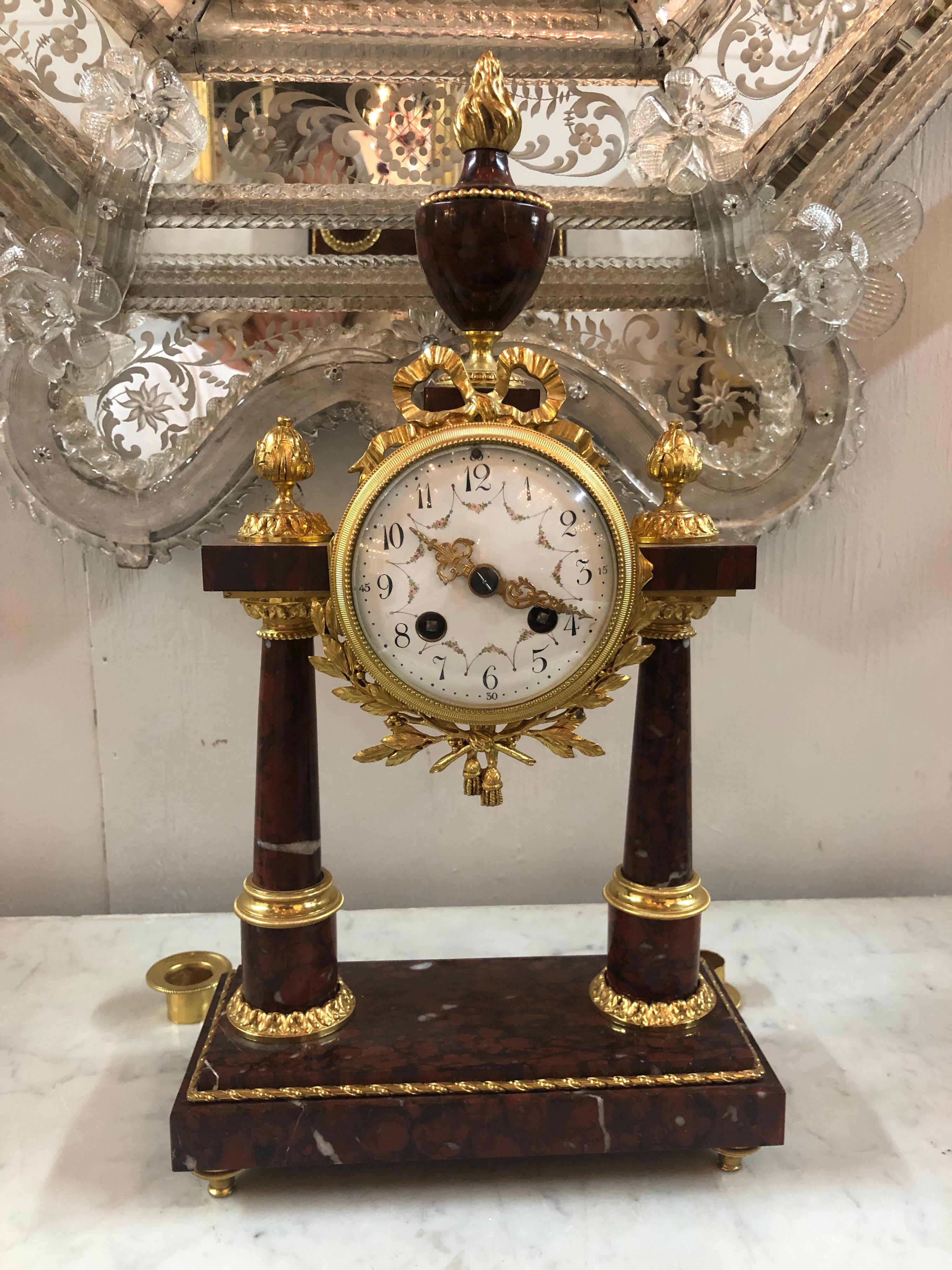 Exceptional 19th century French 3-piece rouge marble and bronze clock set. Very fine quality and detail on these pieces.