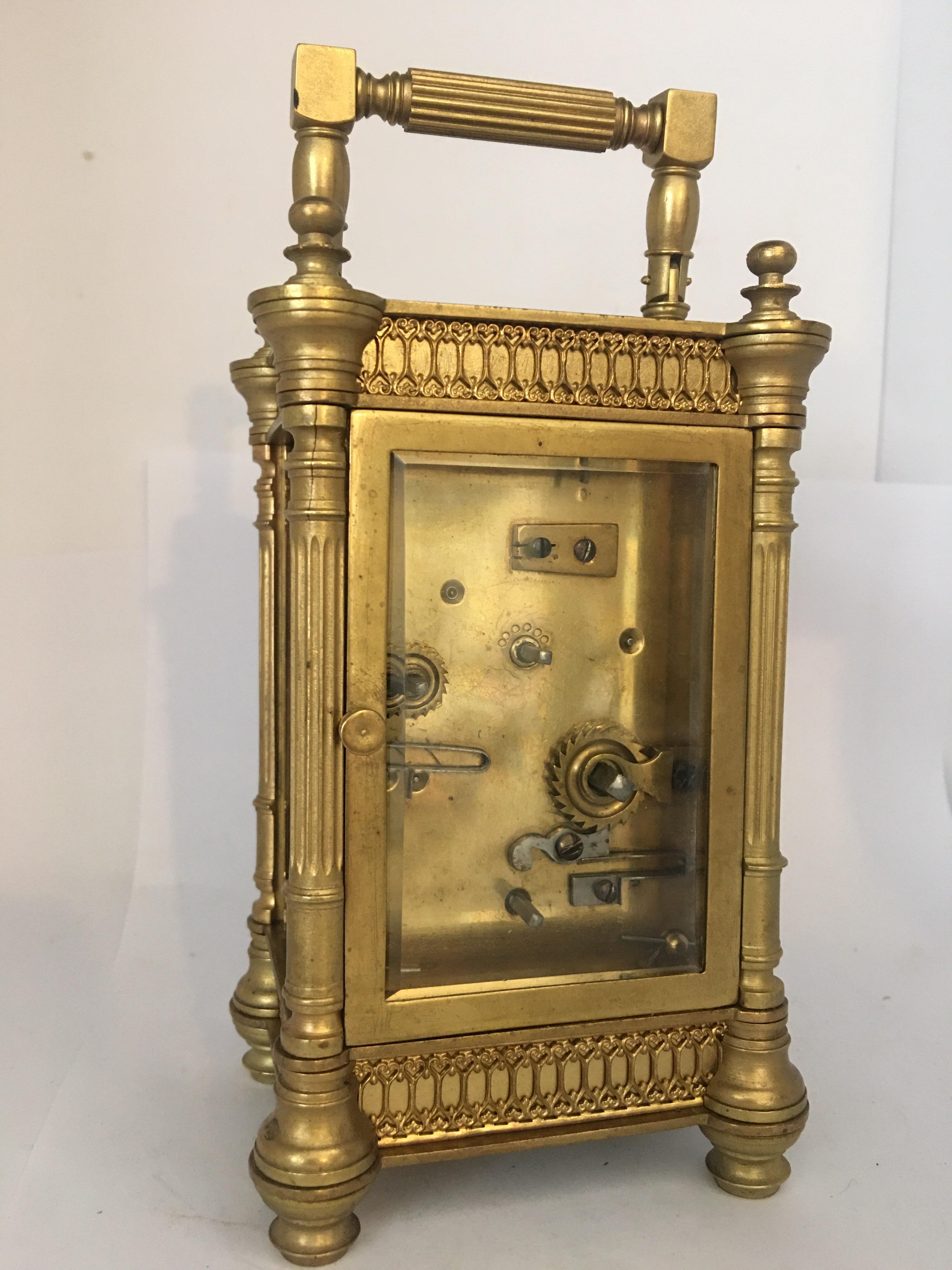 A 19th century French carriage clock with a striking alarm and plated in filigree decoration. With thick bevel edge glass panels.

The image forms part of the description.