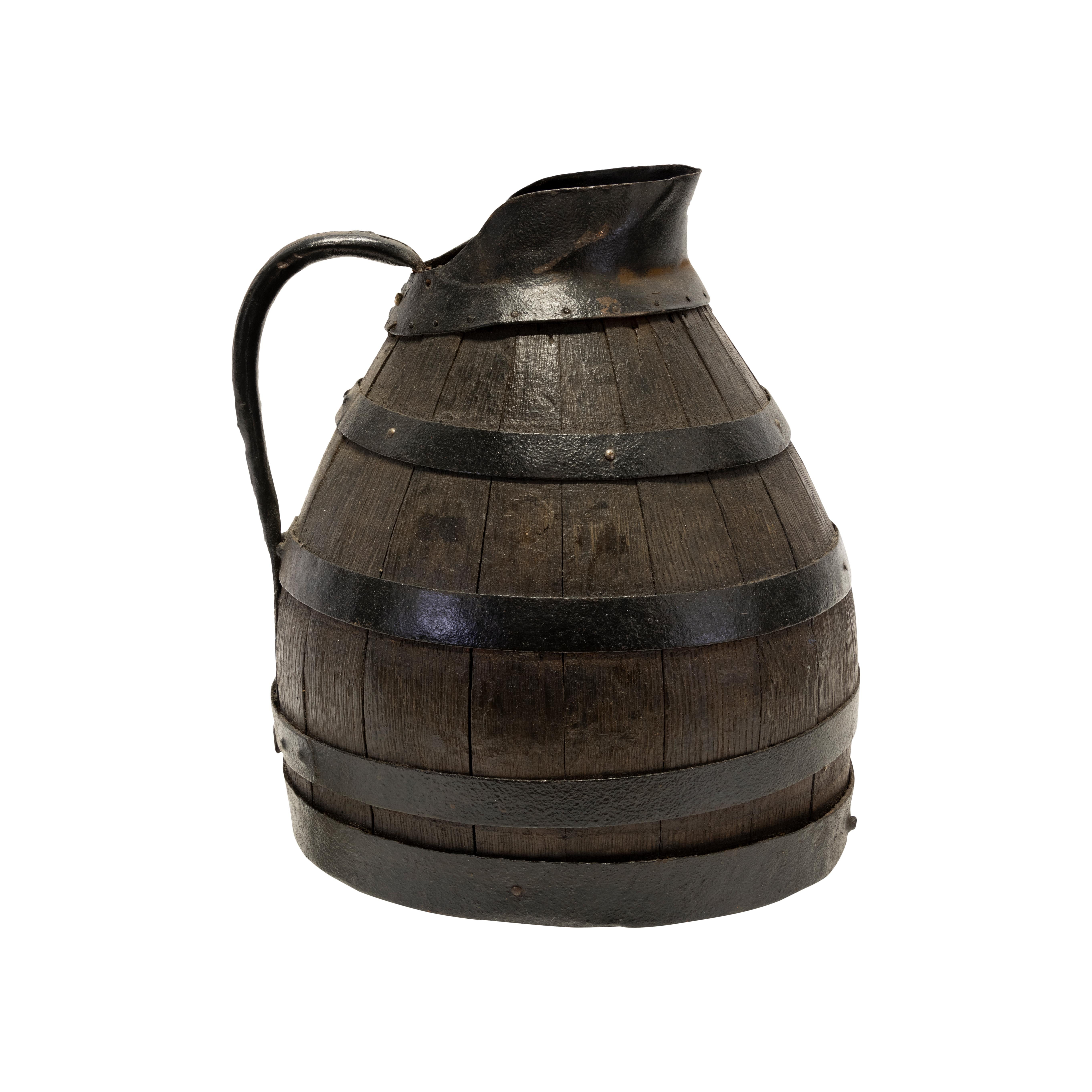 19th Century French Alascian wood and iron banded wine pitcher.

Period: Last quarter of the 19th century
Origin: France
Size: 14
