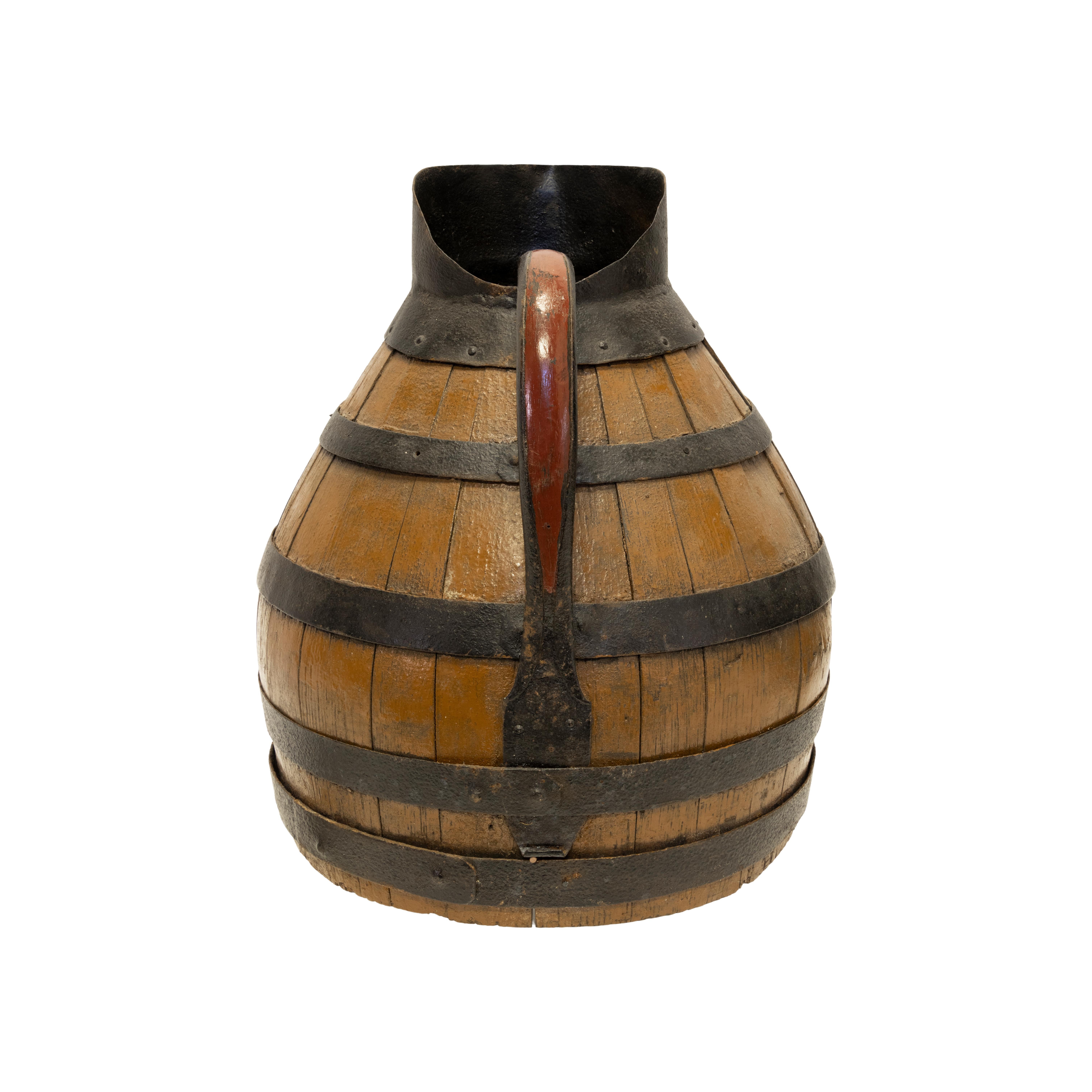 19th Century French Alascian wood and iron banded wine pitcher.

Period: Last quarter of the 19th century
Origin: France
Size: 14