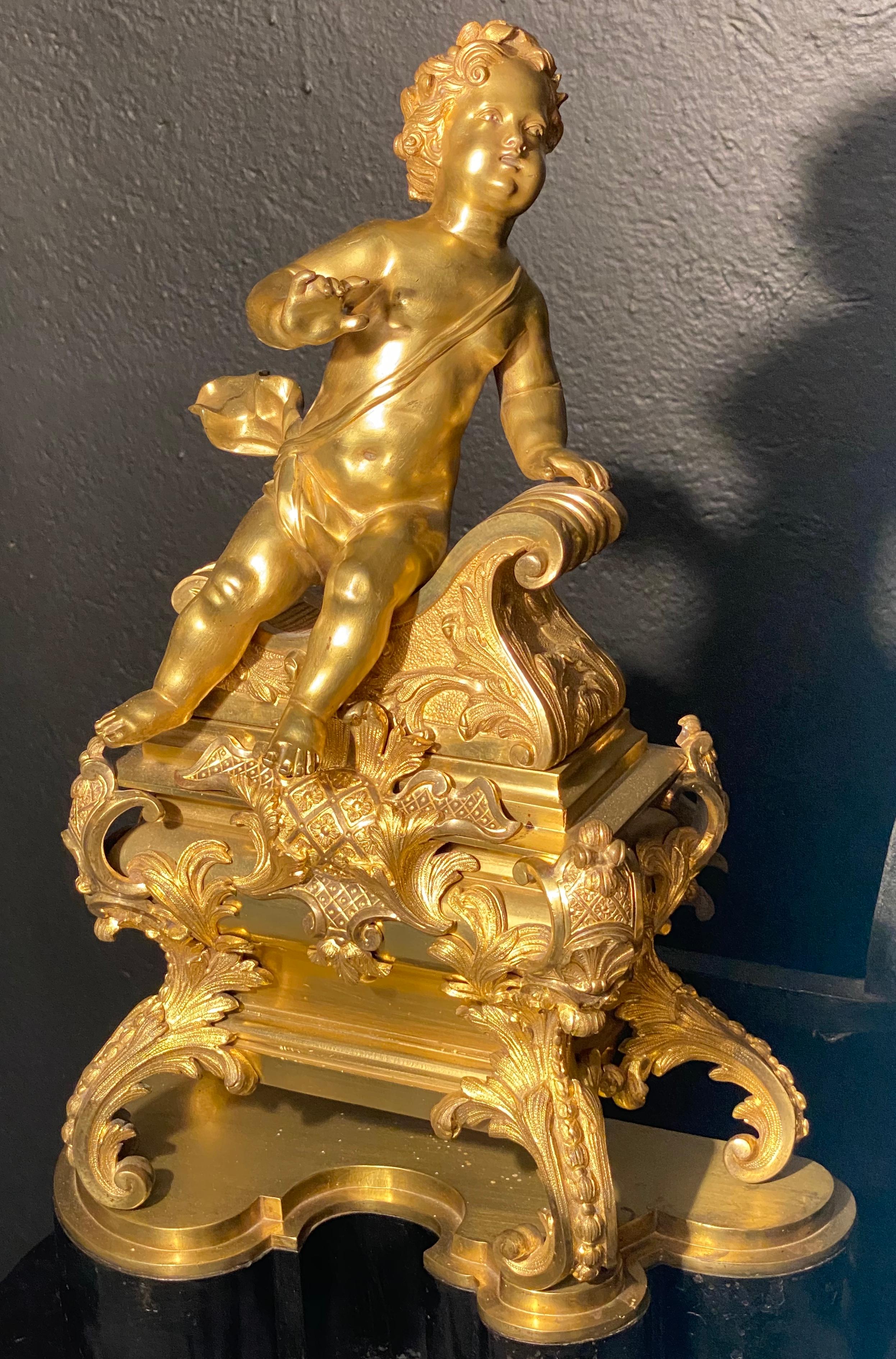 Louis XVI 19th Century French Andirons, Opposing Cherubs on Stands in Doré Bronze