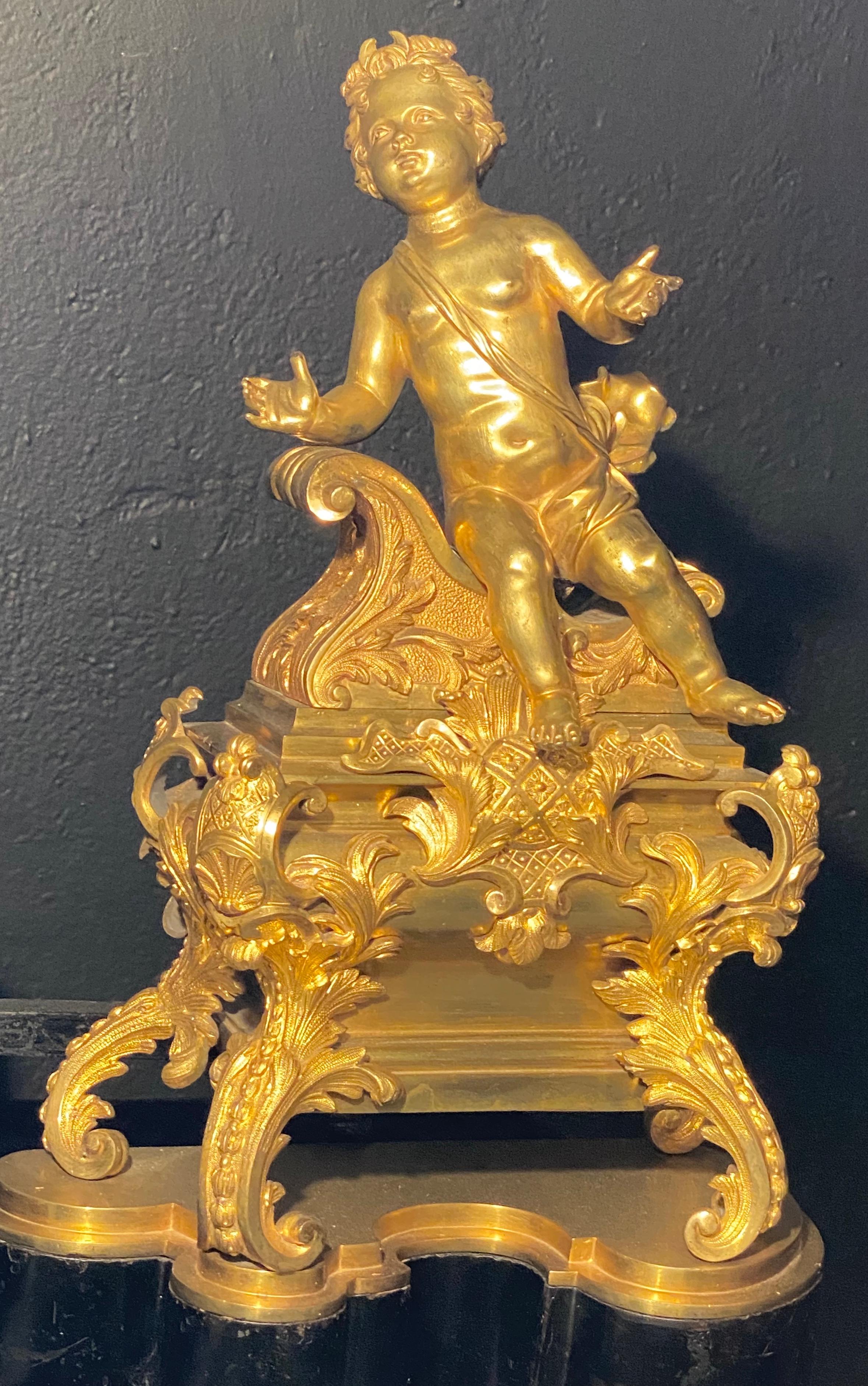 Gilt 19th Century French Andirons, Opposing Cherubs on Stands in Doré Bronze